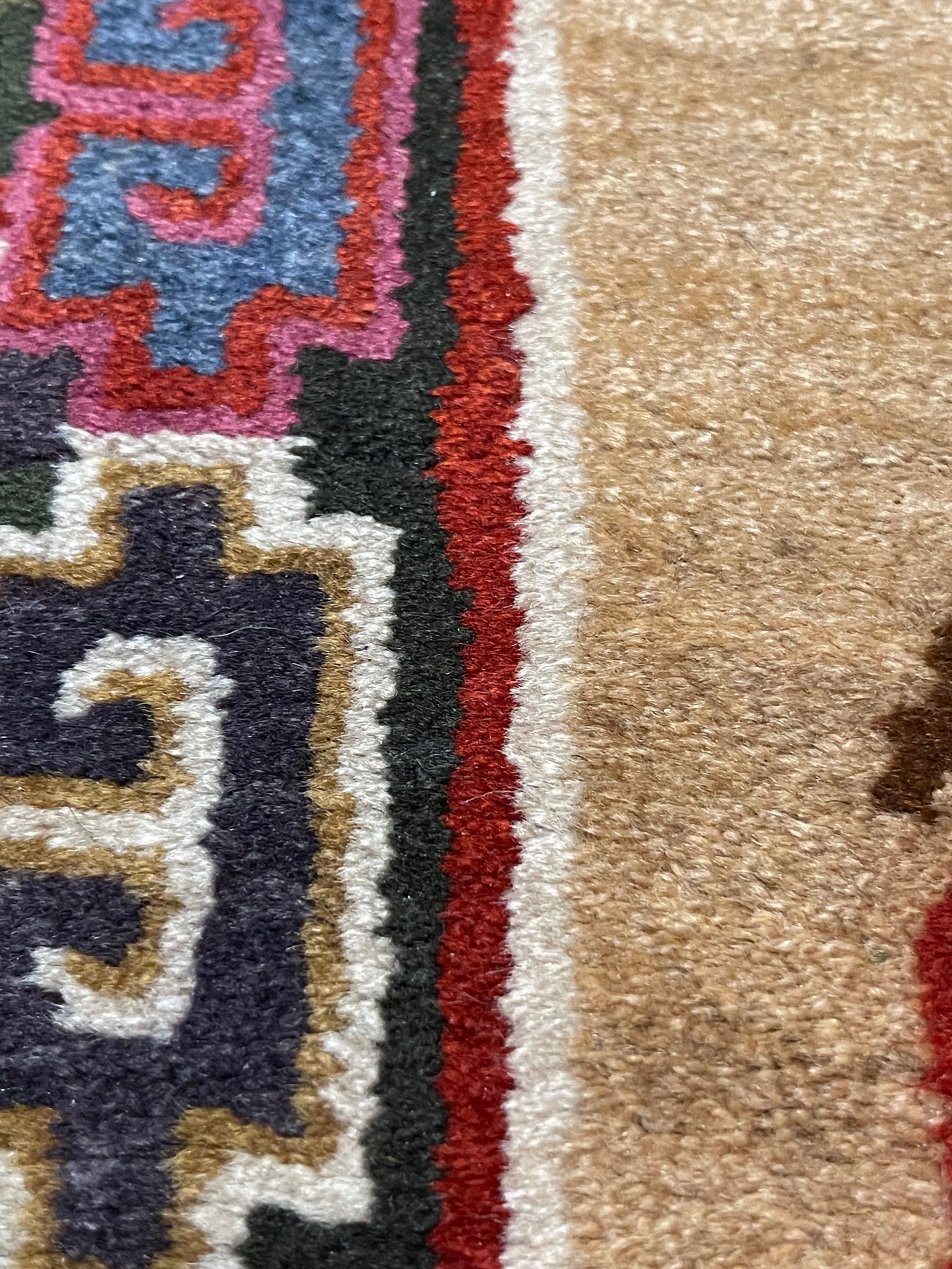 A vintage mid 20th c. Tibetan rug with dragons