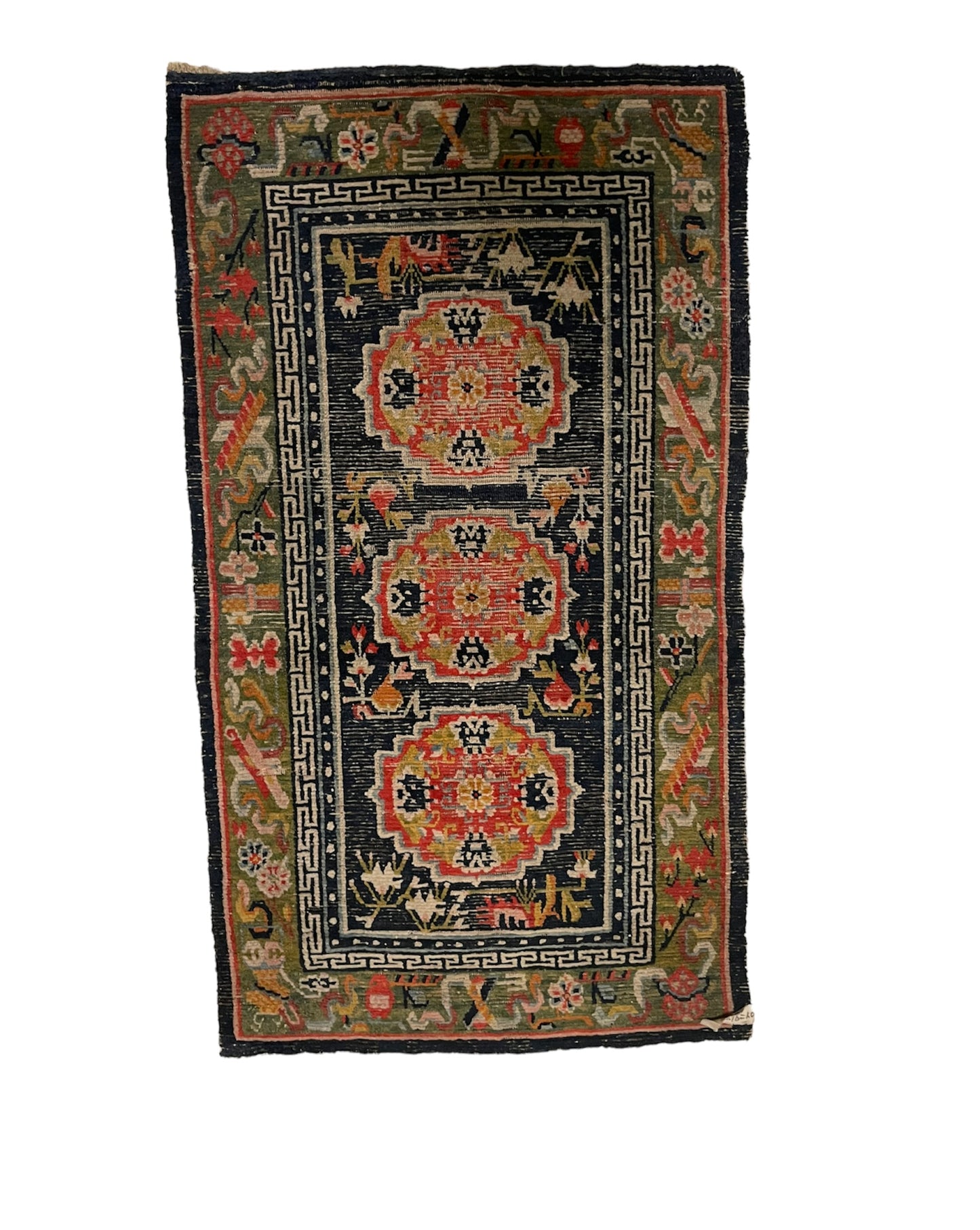 An antique Tibetan residential rug with medallions