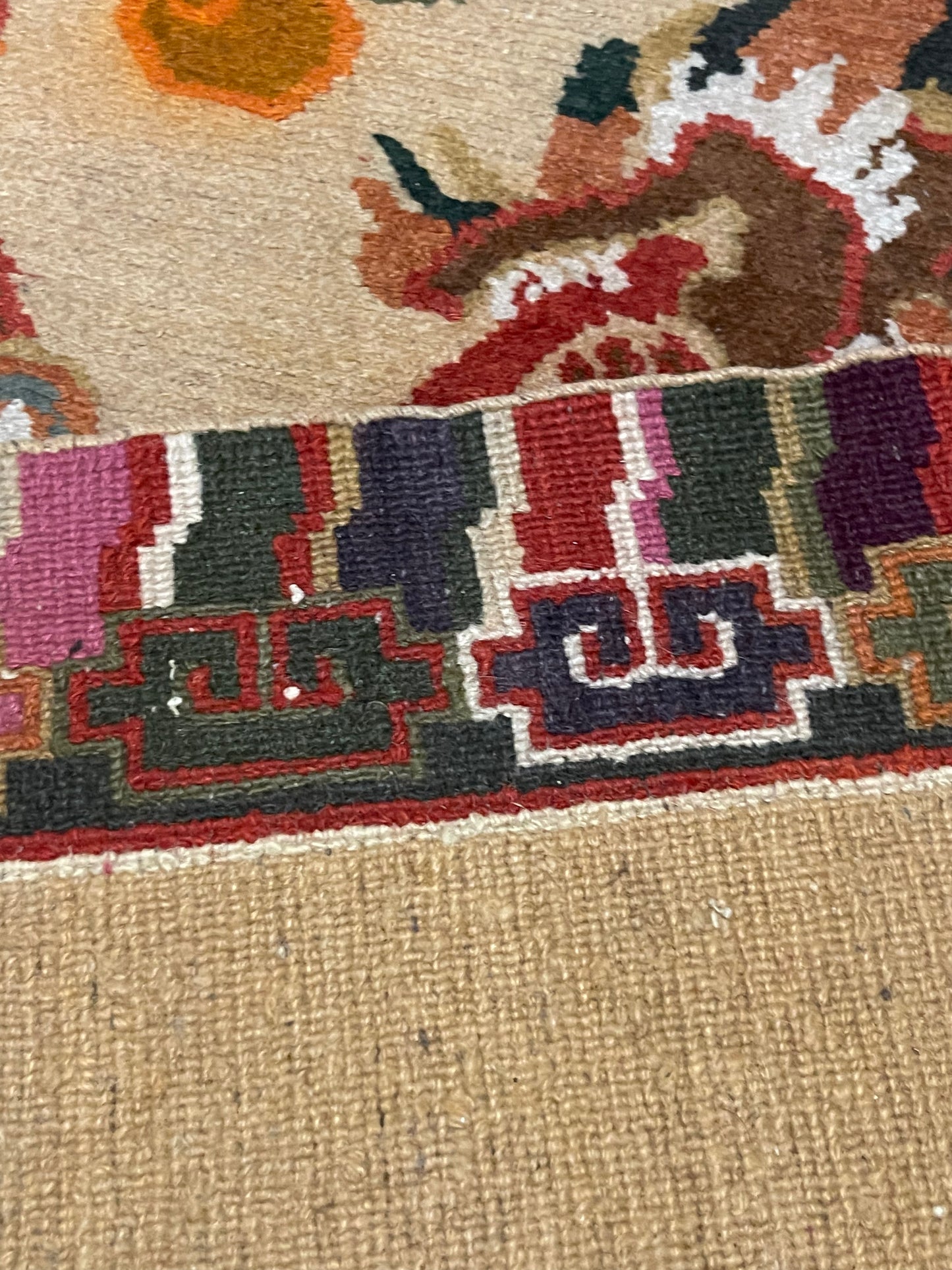 A vintage mid 20th c. Tibetan rug with dragons