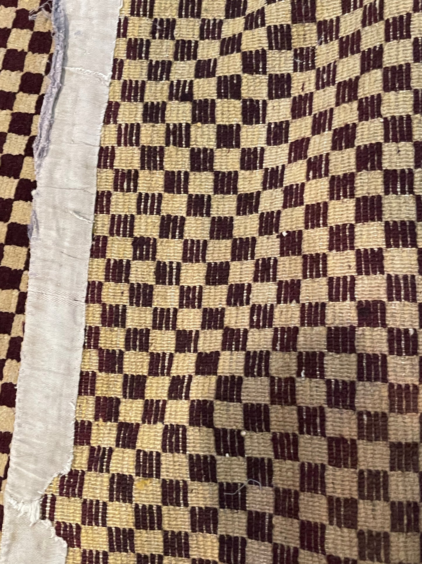 An antique Tibetan checkerboard handmade wool rug