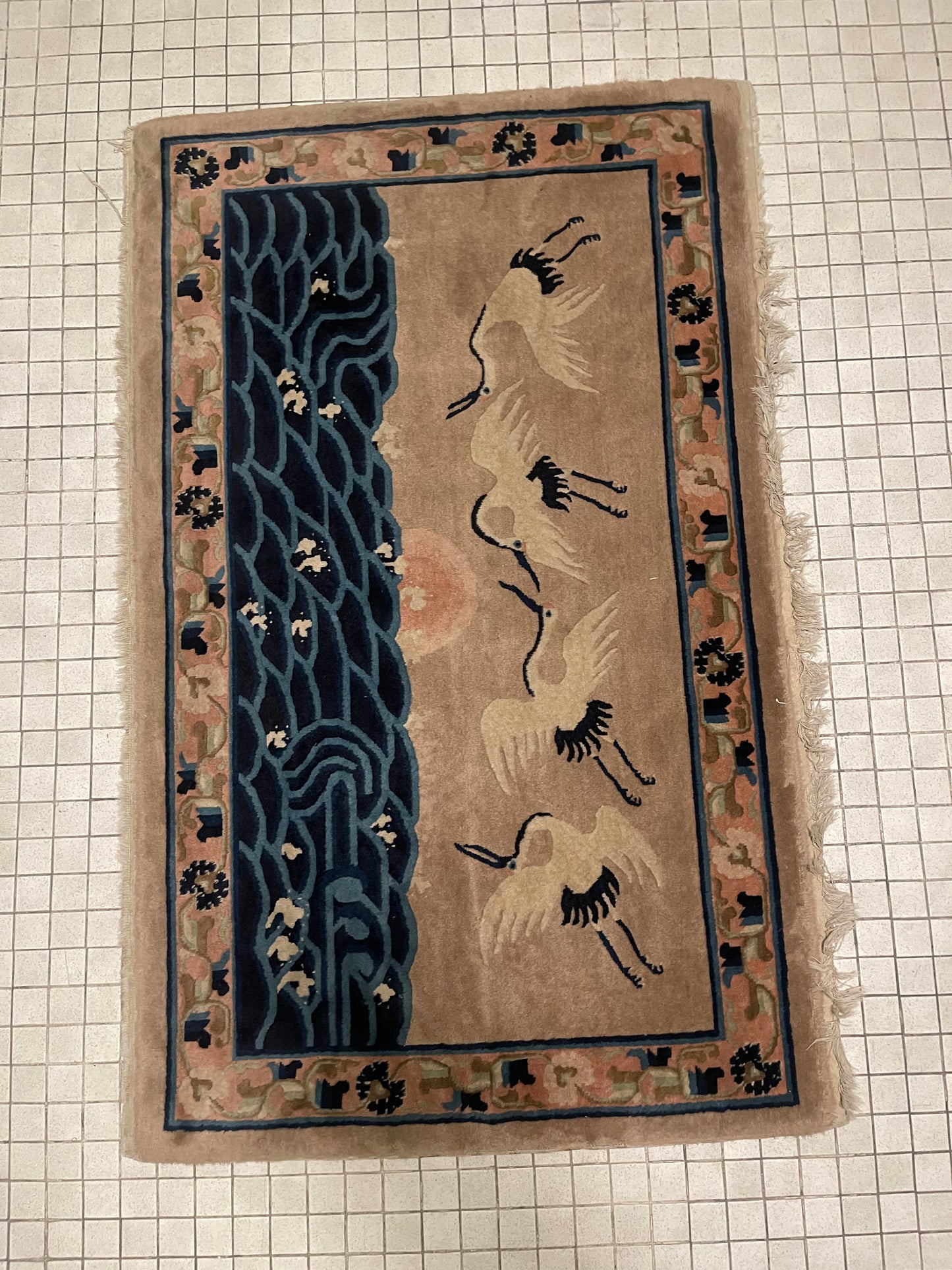 An antique Chinese pictorial rug