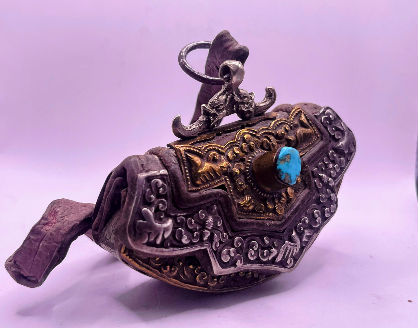 An antique Tibetan mechak purse with turquoise