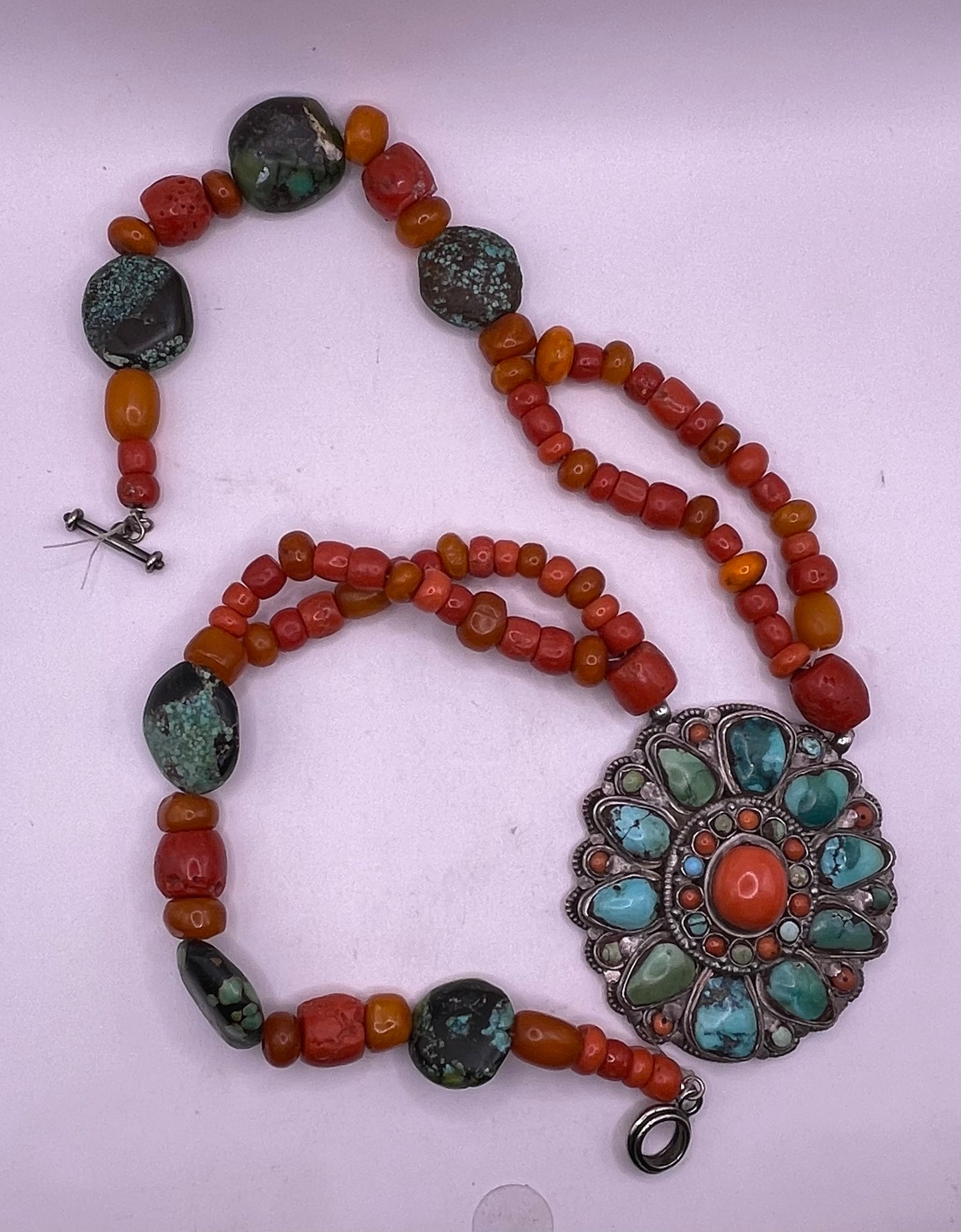 Coral, amber and turquoise necklace with a turquoise and coral silver pendant