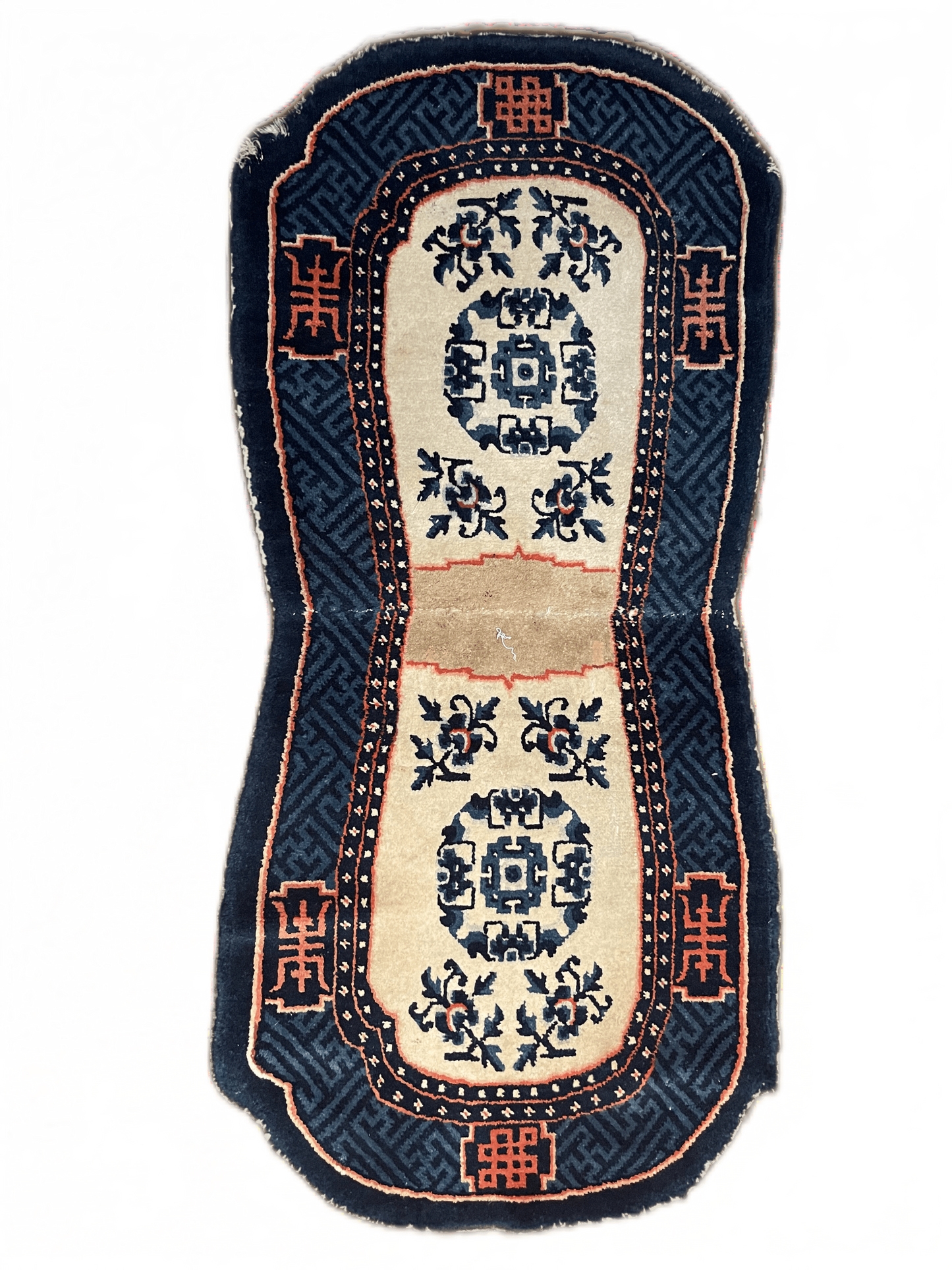 A vintage Tibetan indigo rounded woolen saddle rug
