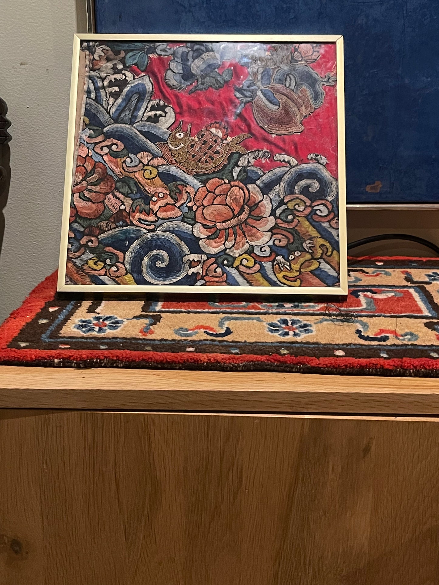 An antique framed Chinese embroidered textile fragment