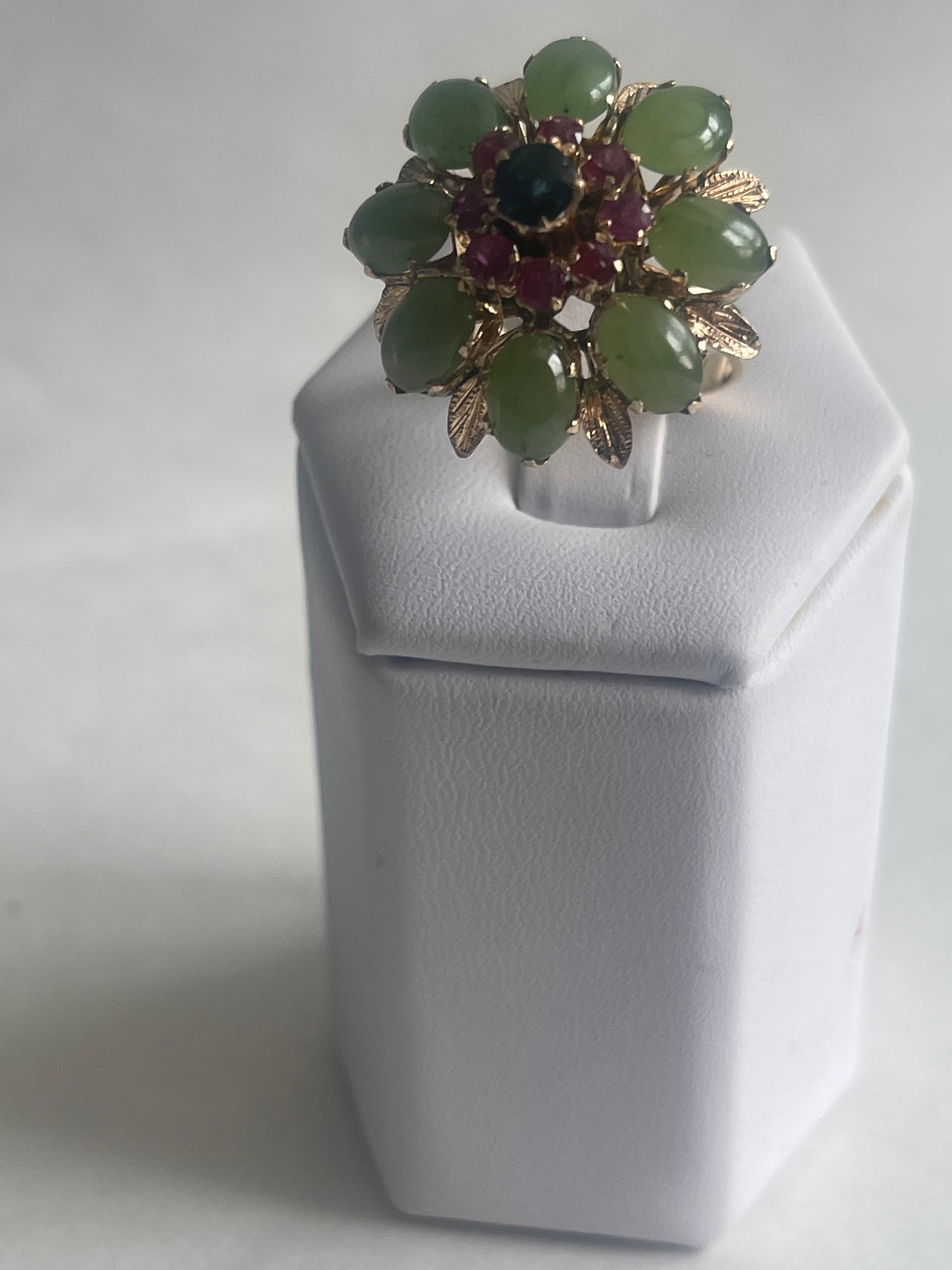 A vintage jade, ruby and sapphire cocktail ring