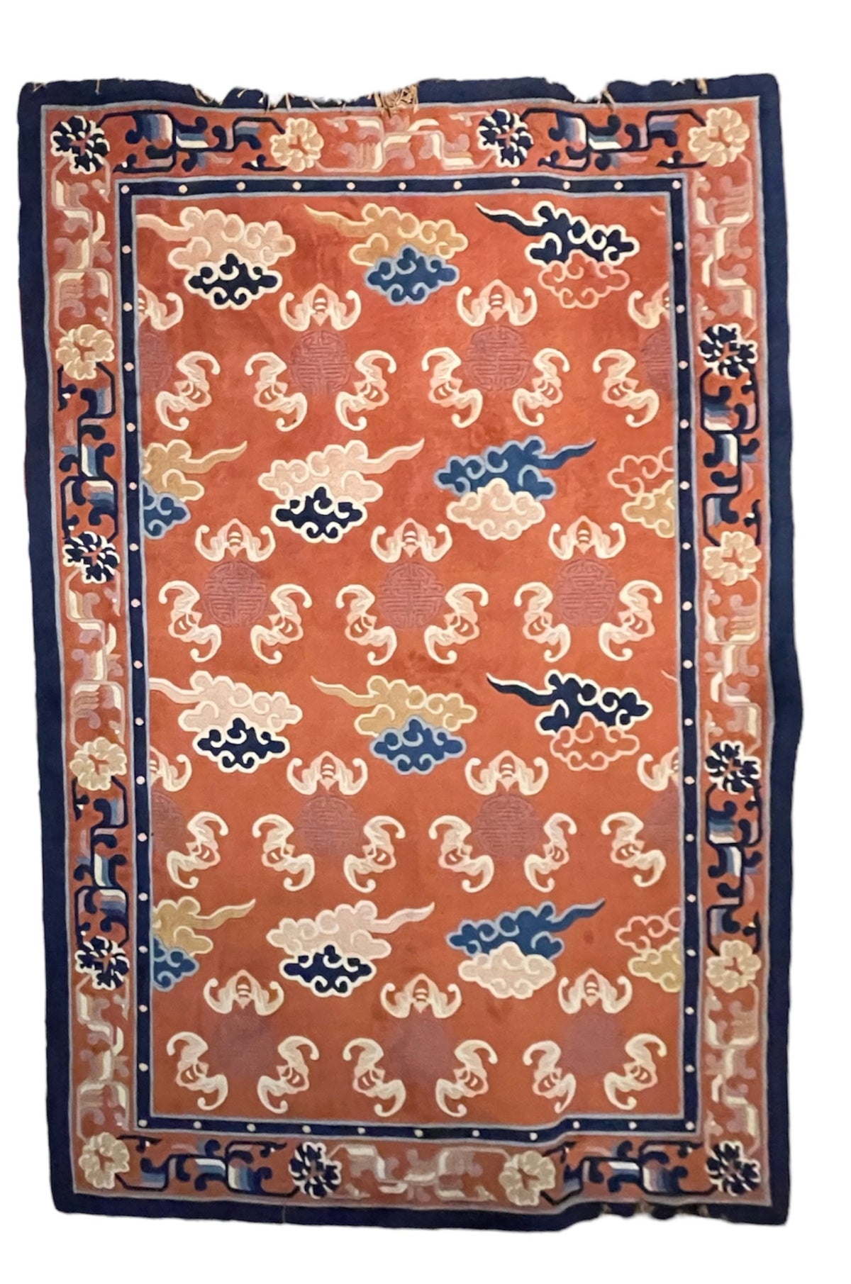A mid 20th C. Peking rug with clouds and bats motifs