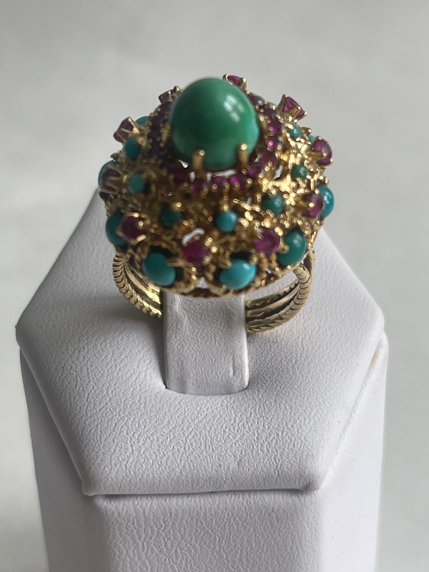 A vintage turquoise dome ring with rubies in a 14kt setting