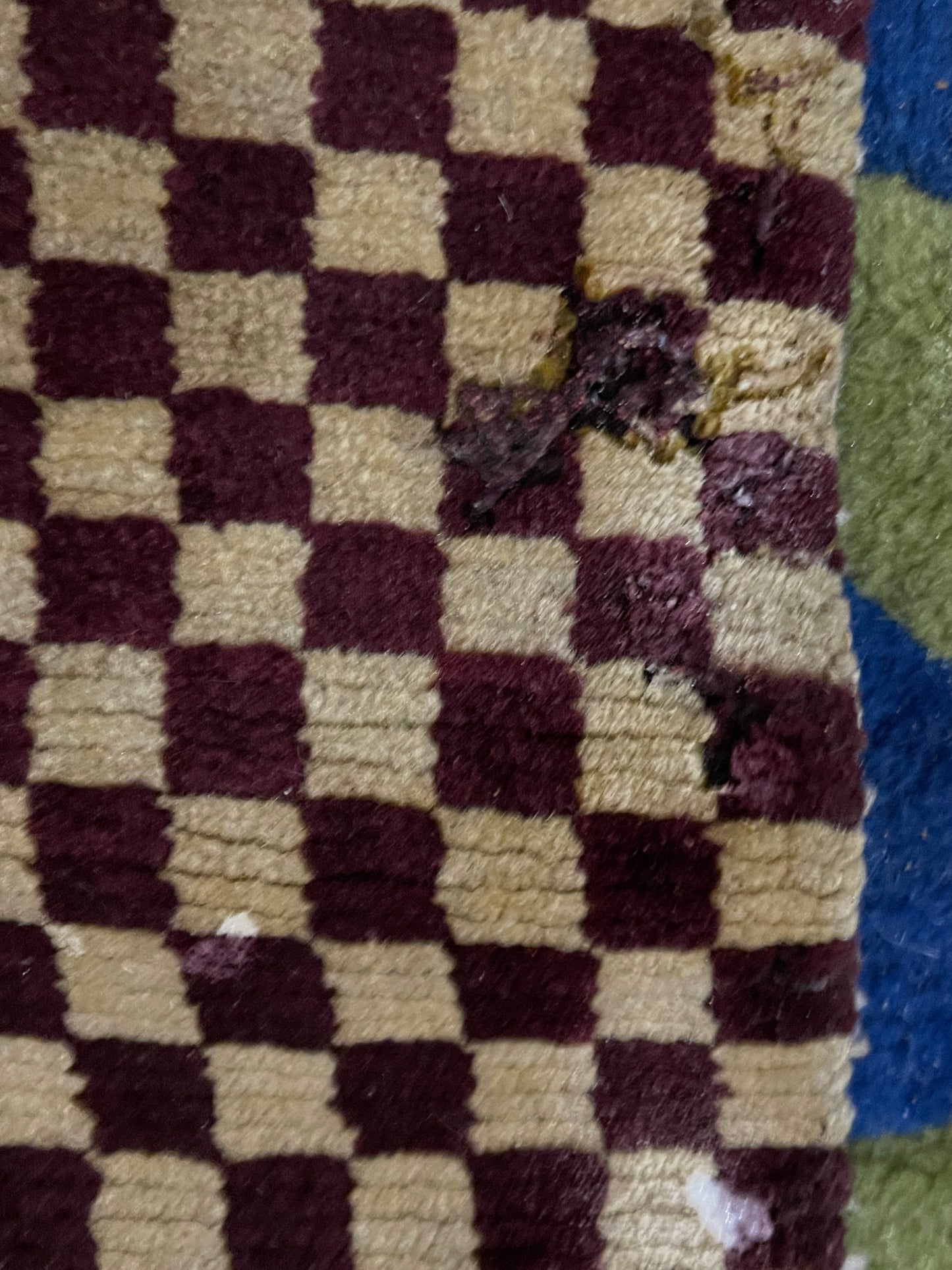 An antique Tibetan checkerboard handmade wool rug