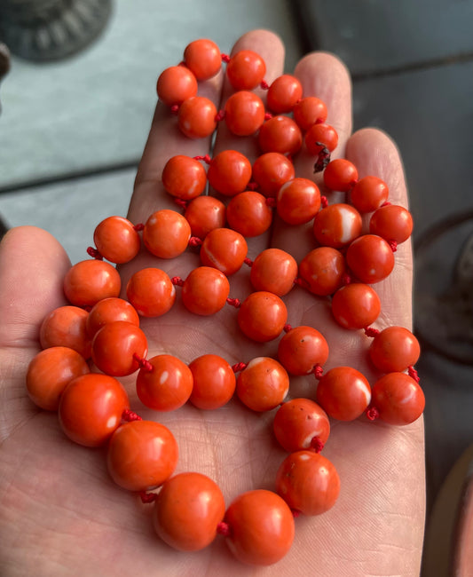A necklace with vintage momo coral beads