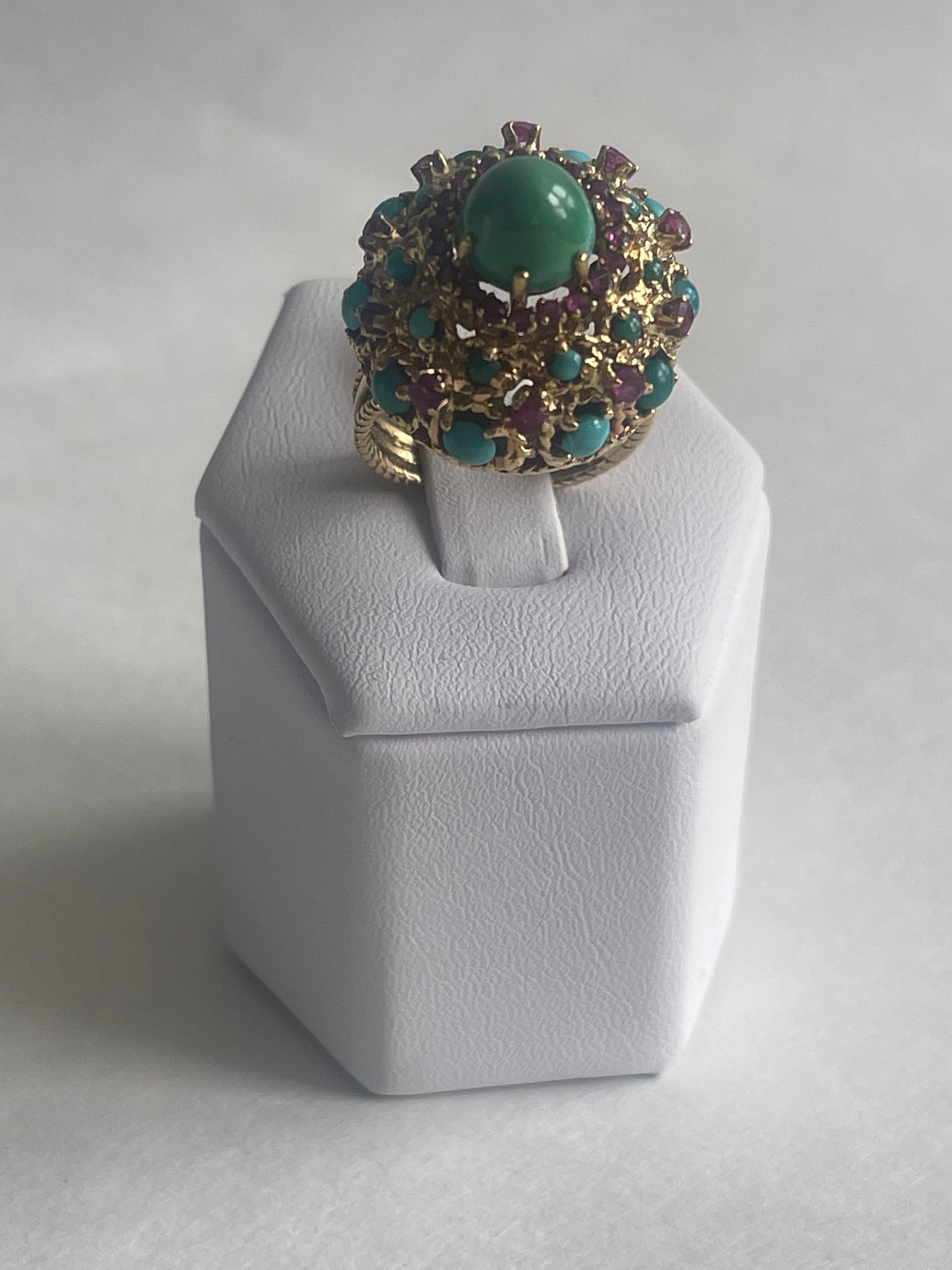 A vintage turquoise dome ring with rubies in a 14kt setting