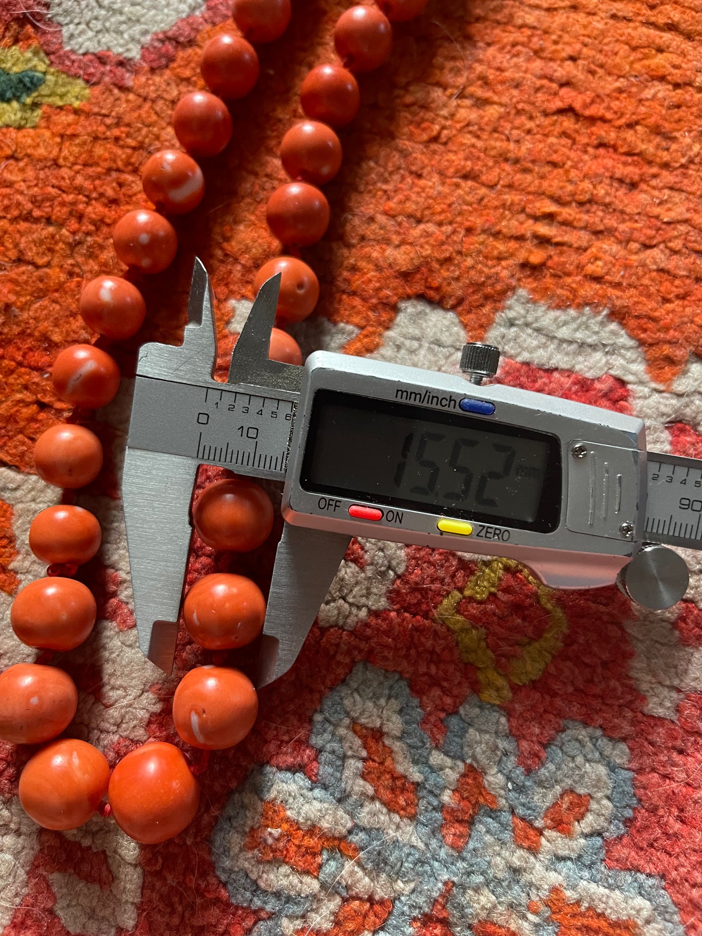 A necklace with vintage momo coral beads