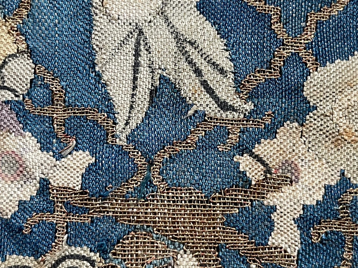 An antique framed Chinese silk kesi of a pair of dragons