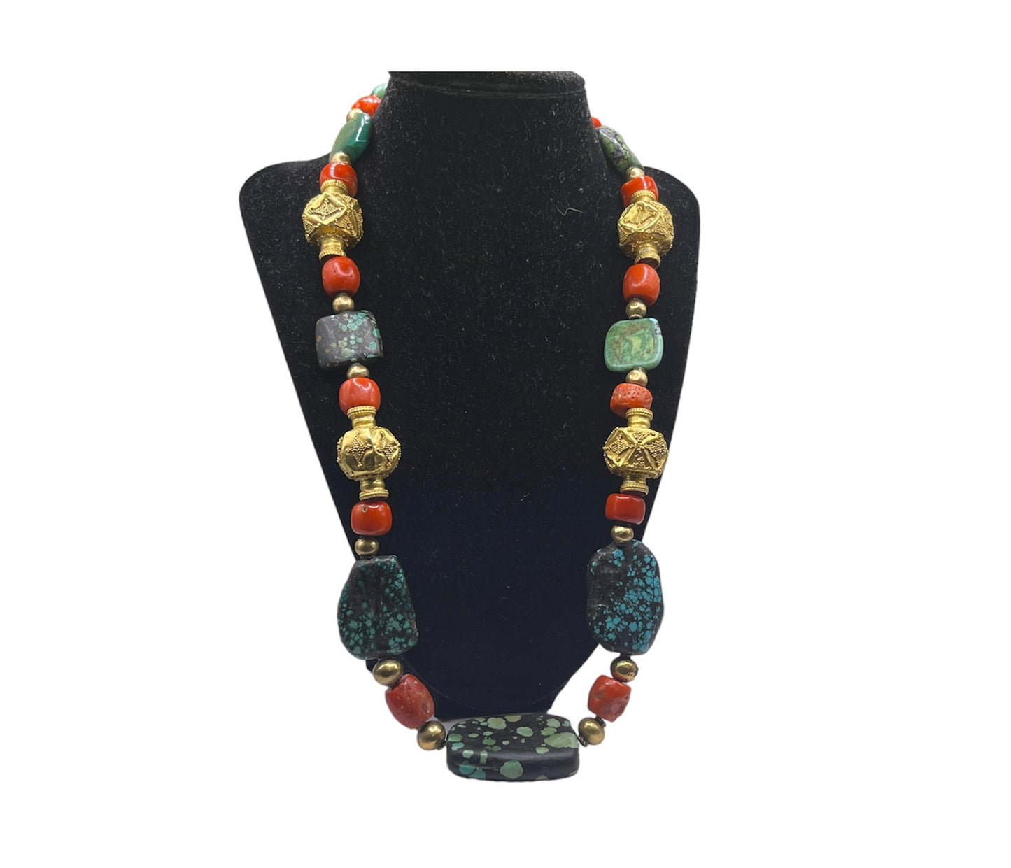 A necklace with antique Tibetan turquoise beads, coral beads and gold beads