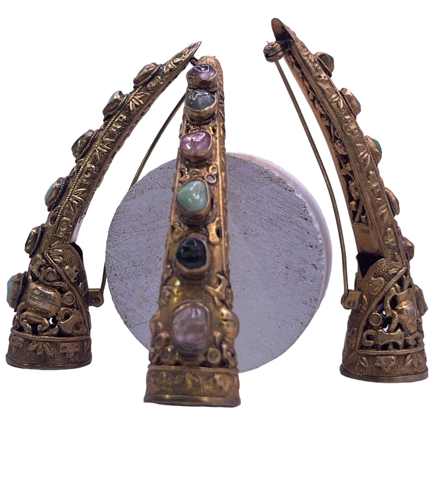 A set of three vintage gilded silver nail covers