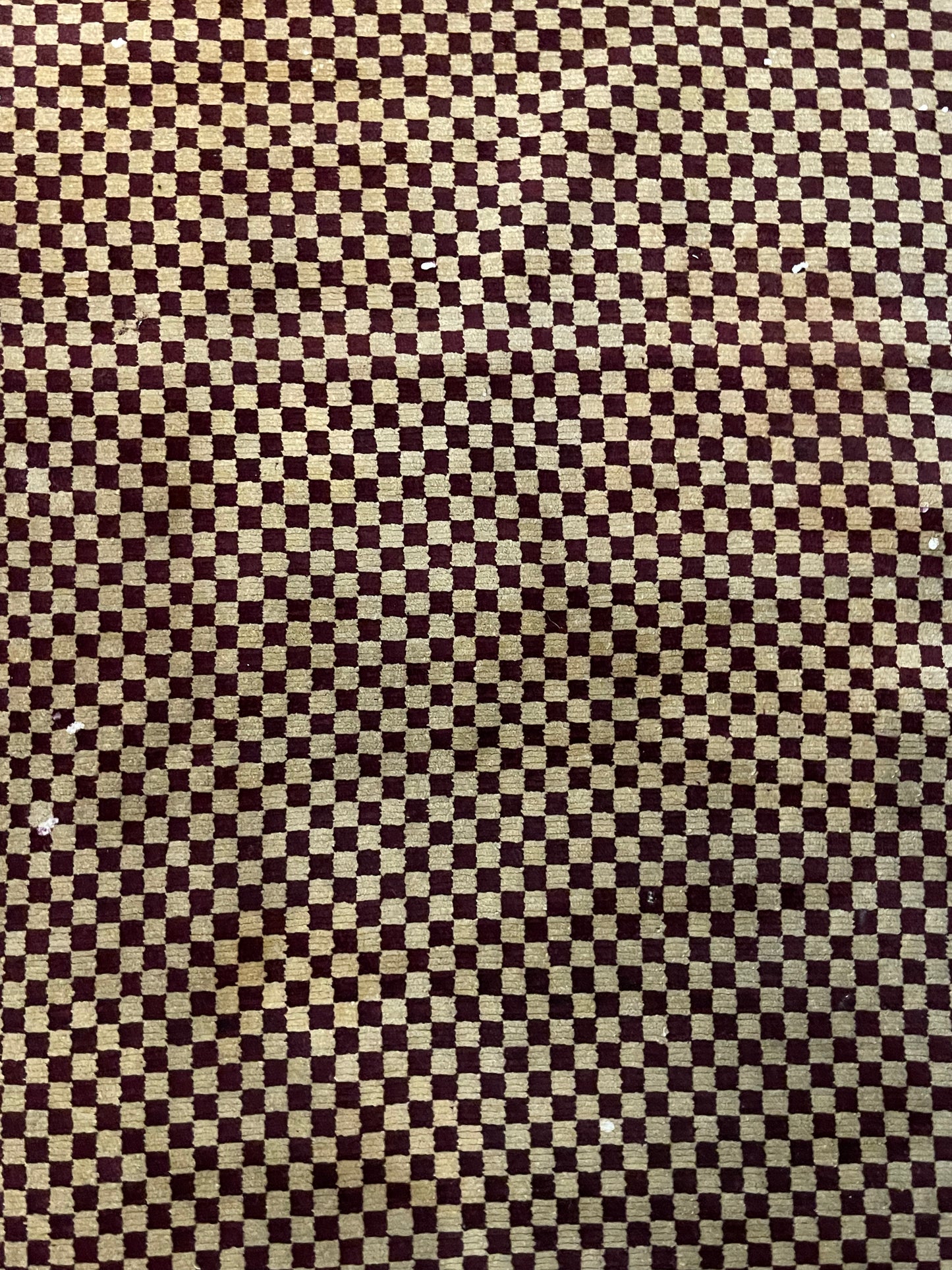 An antique Tibetan checkerboard handmade wool rug