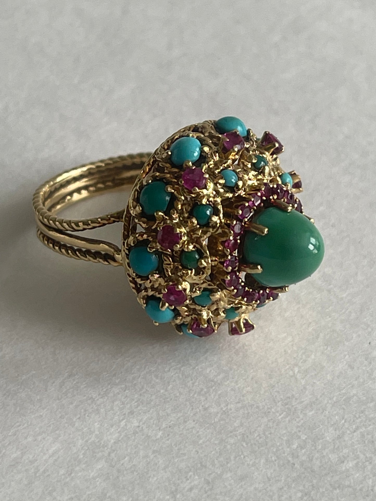 A vintage turquoise dome ring with rubies in a 14kt setting