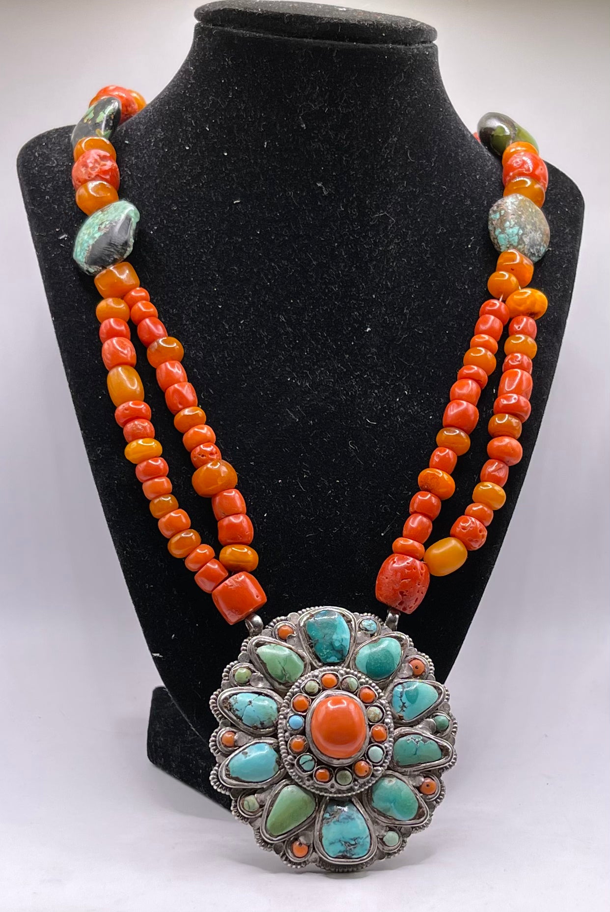 Coral, amber and turquoise necklace with a turquoise and coral silver pendant