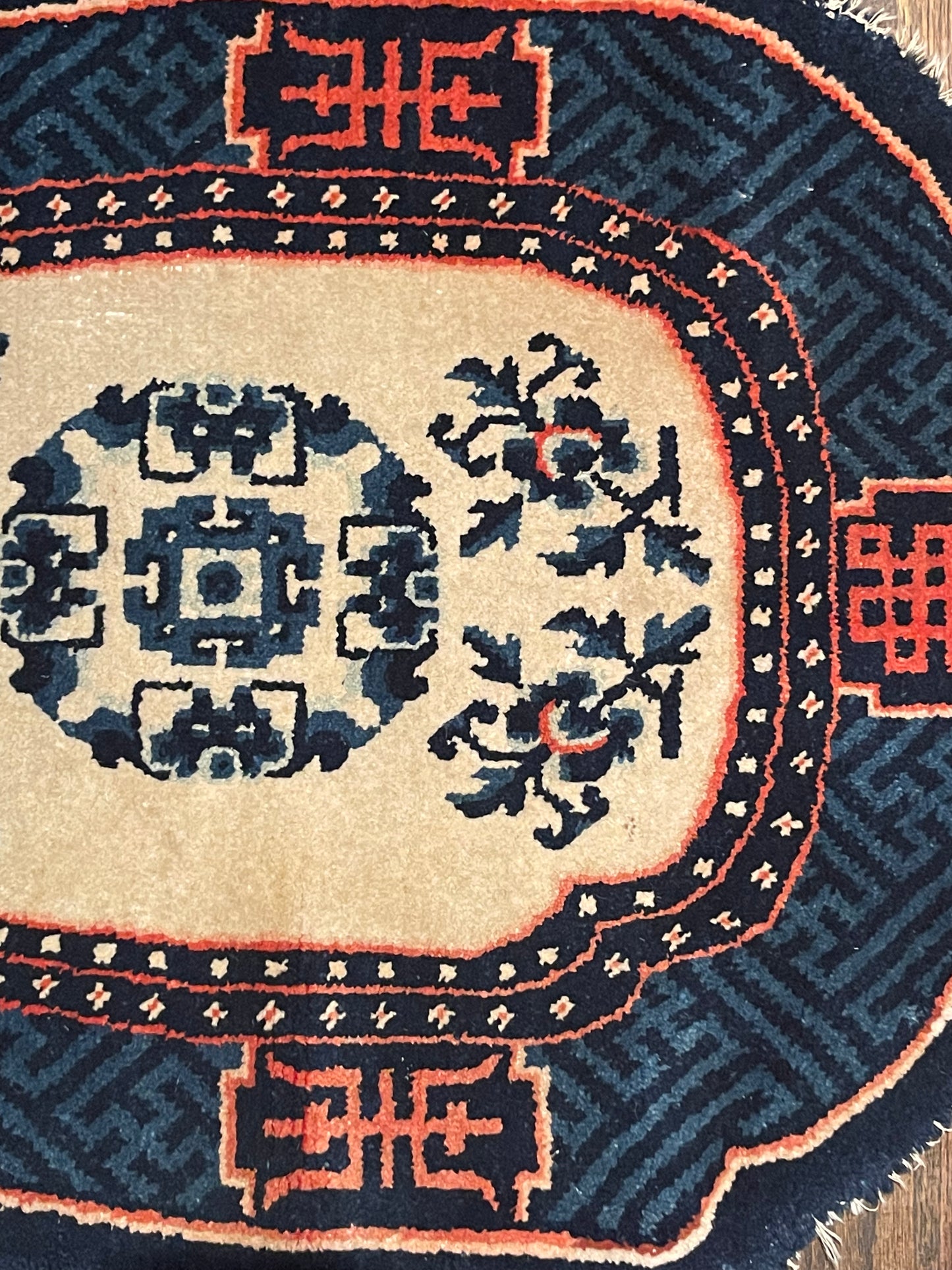 A vintage Tibetan indigo rounded woolen saddle rug