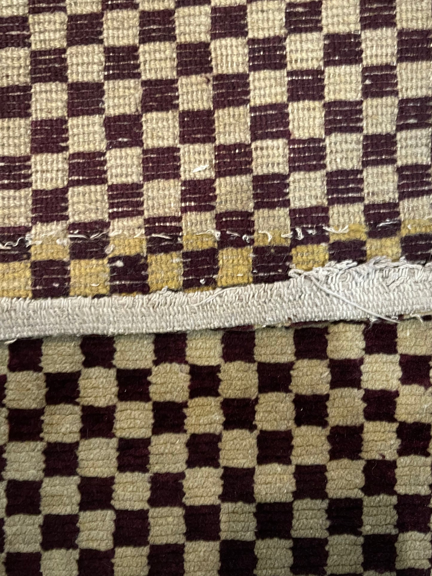 An antique Tibetan checkerboard handmade wool rug