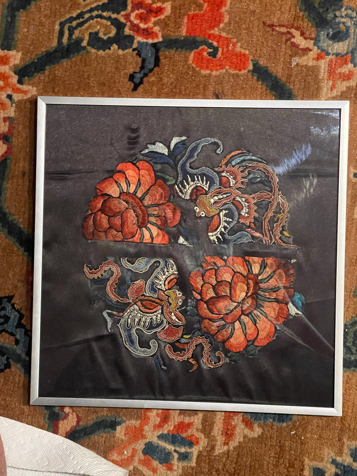 An antique framed Chinese embroidered textile fragment