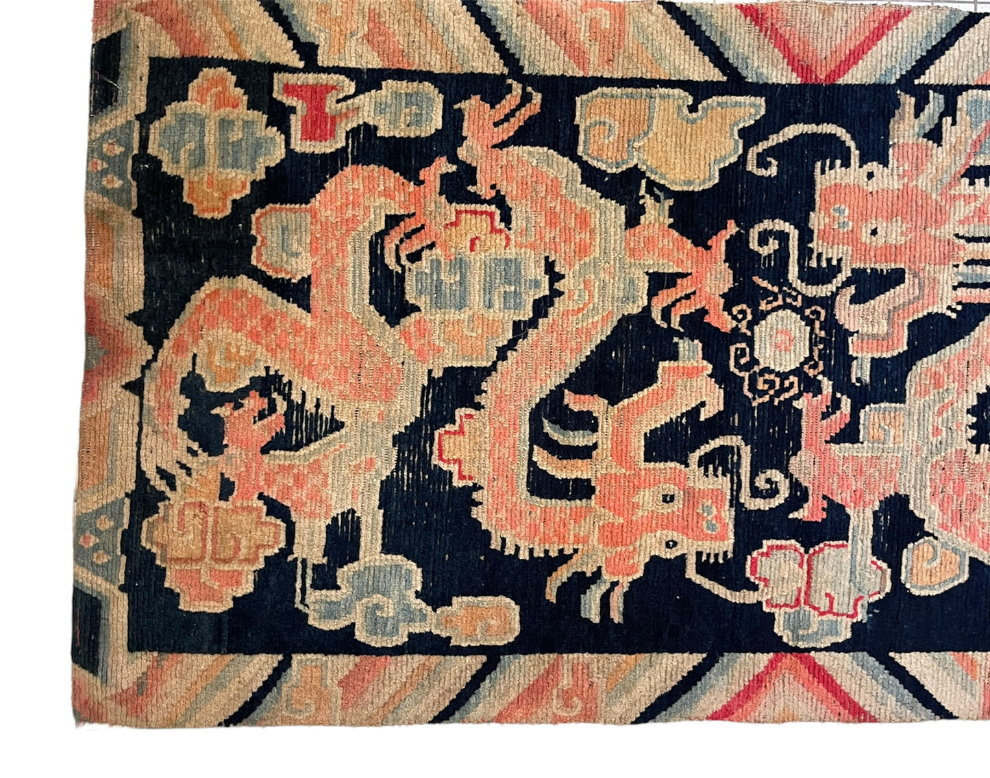 A 19th C., antique Tibetan dragon rug