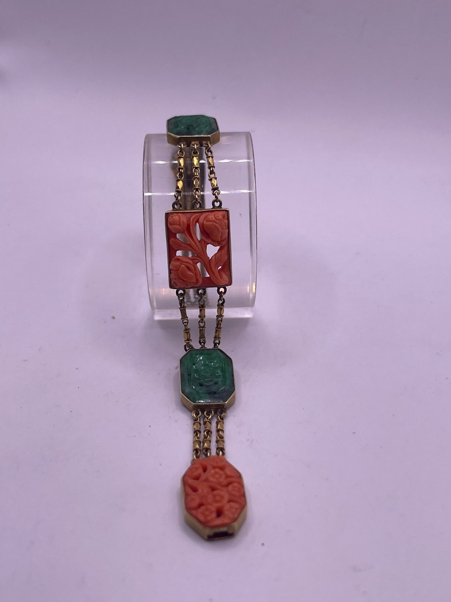 A jade and coral plaque in 14kt bracelet