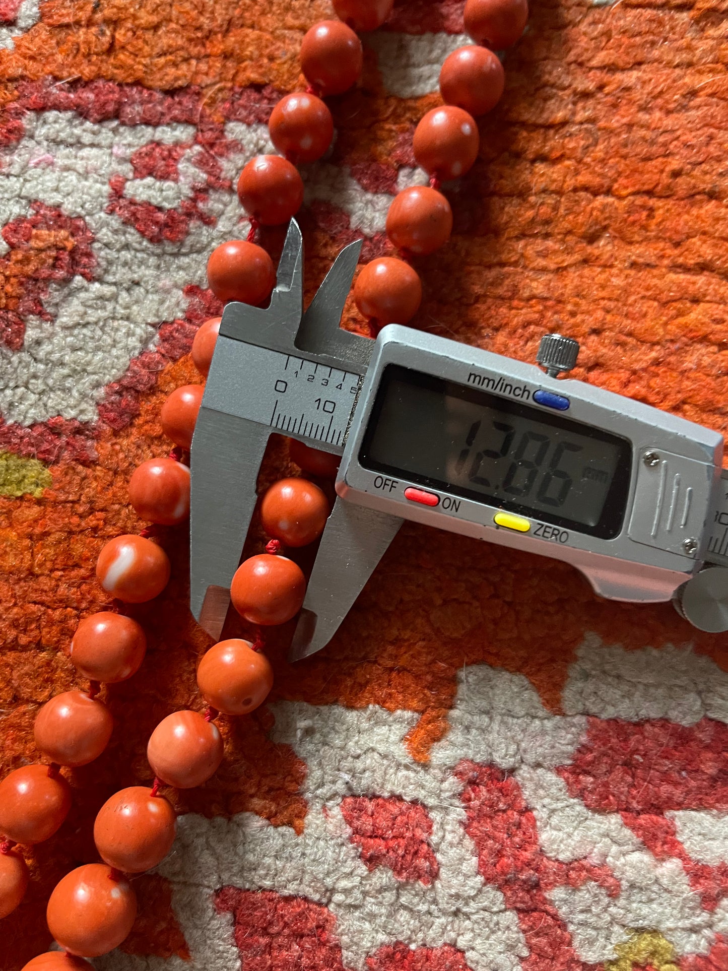 A necklace with vintage momo coral beads