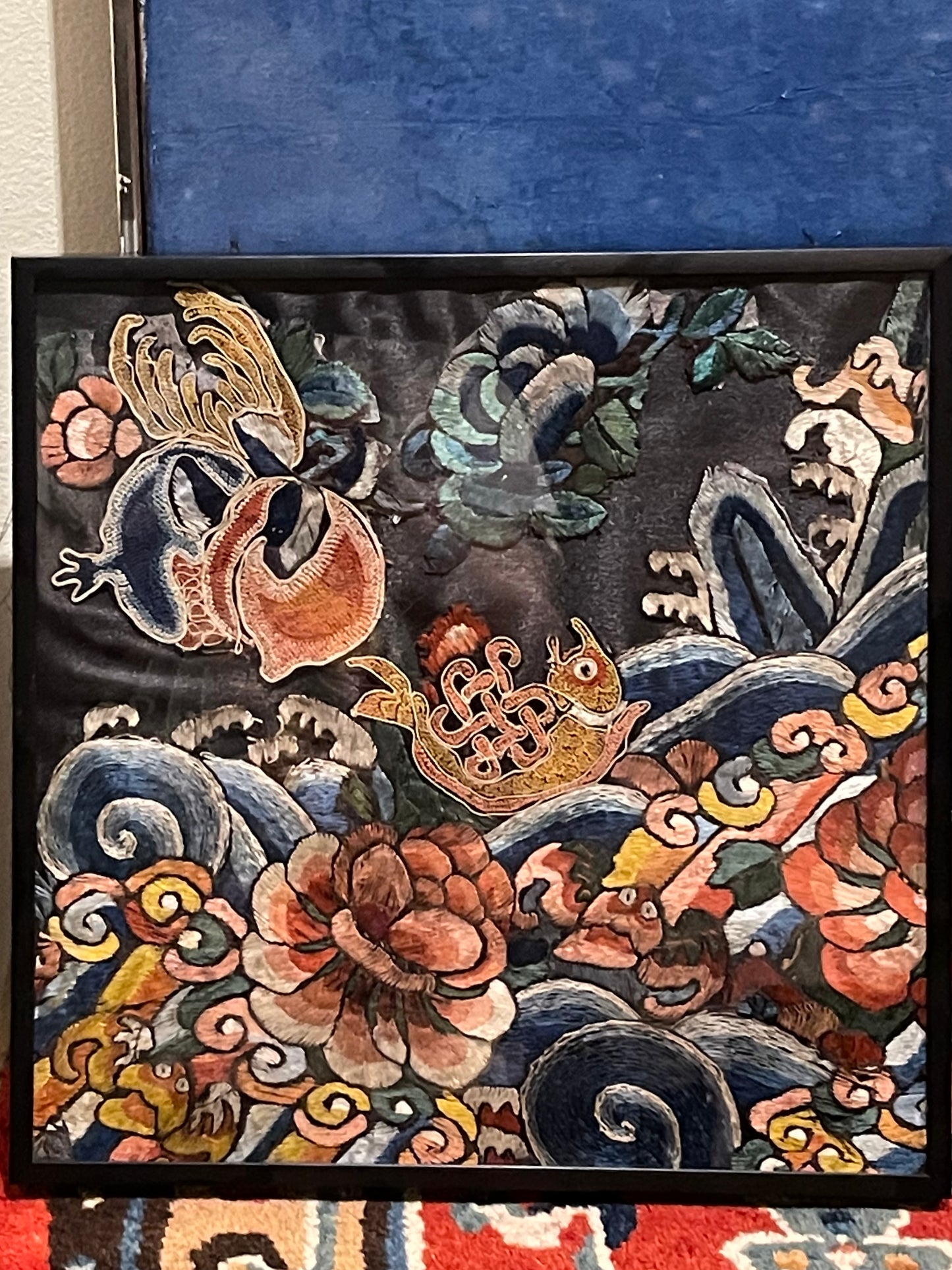 An antique framed Chinese embroidered textile fragment
