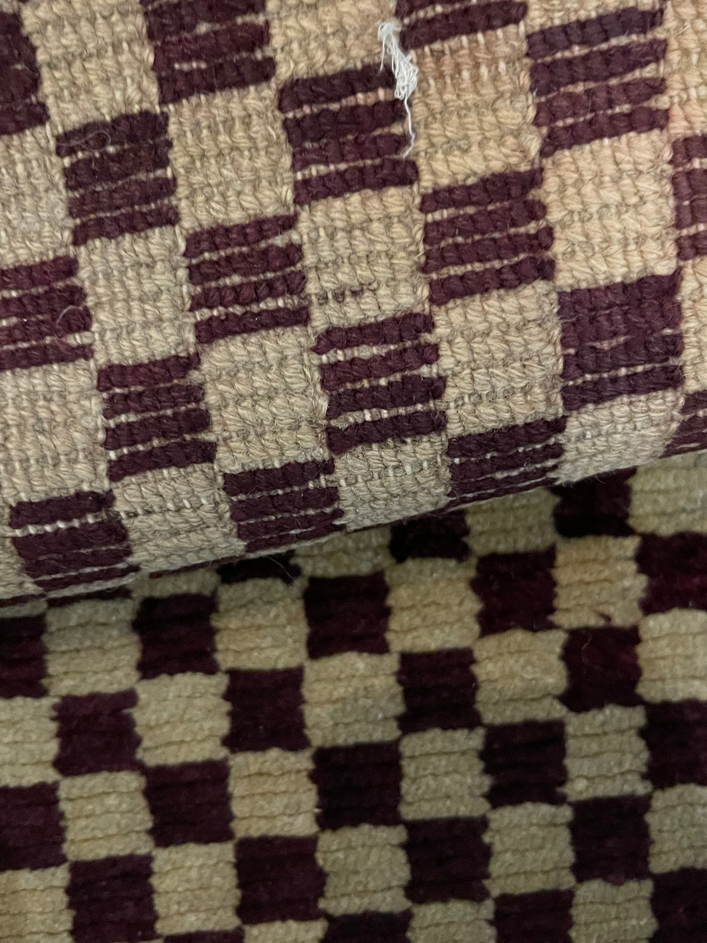 An antique Tibetan checkerboard handmade wool rug
