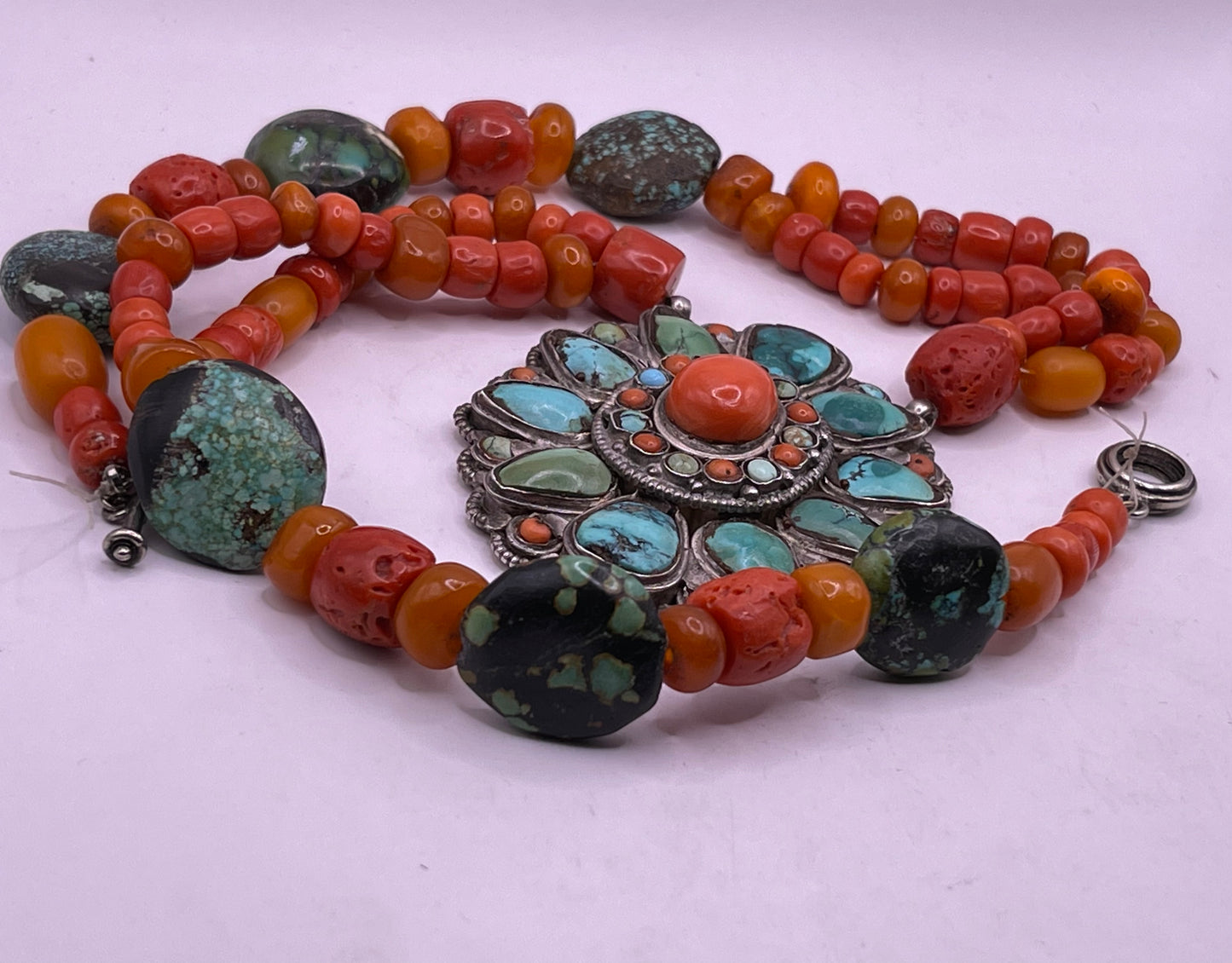 Coral, amber and turquoise necklace with a turquoise and coral silver pendant