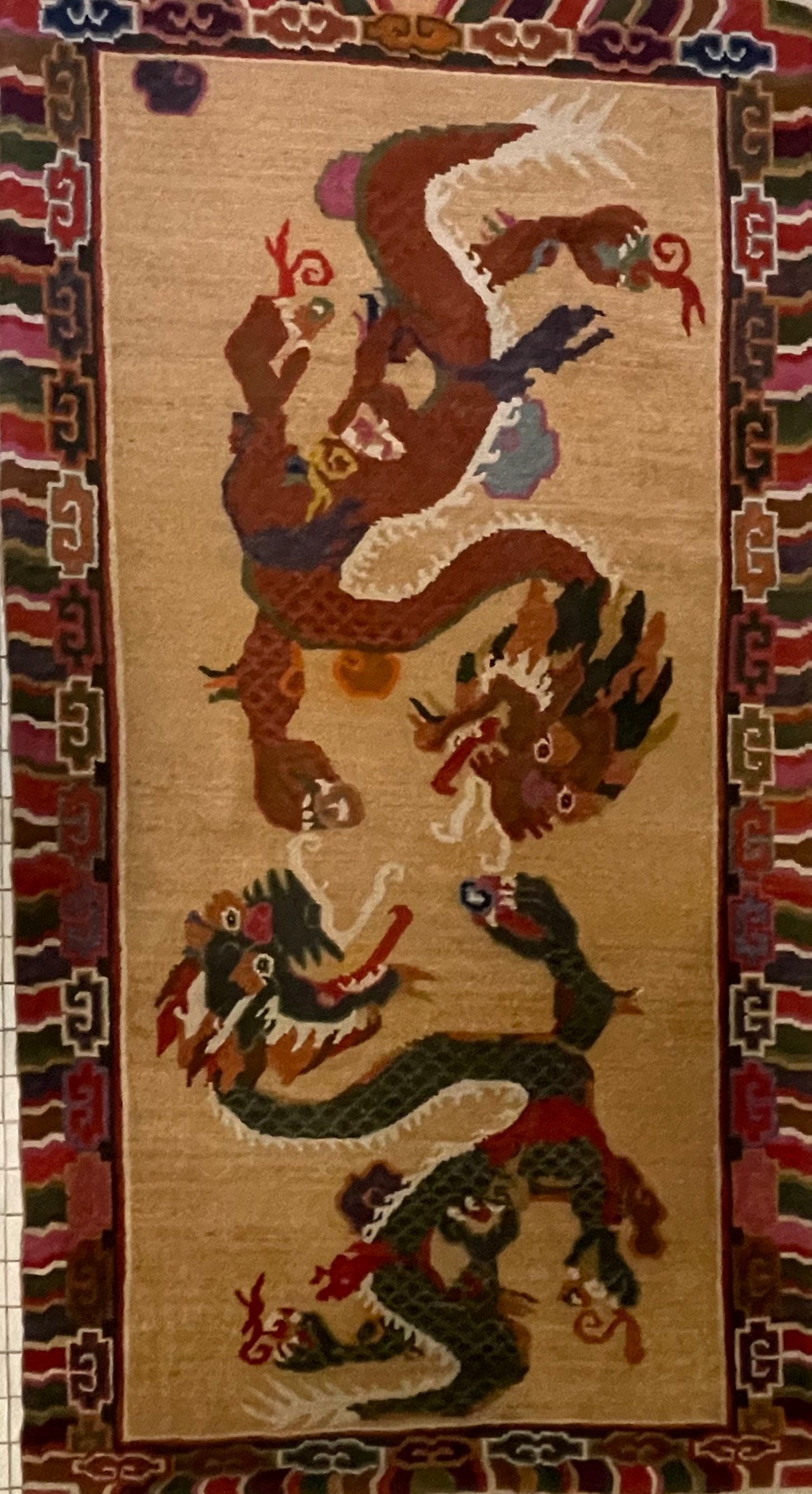 A vintage mid 20th c. Tibetan rug with dragons