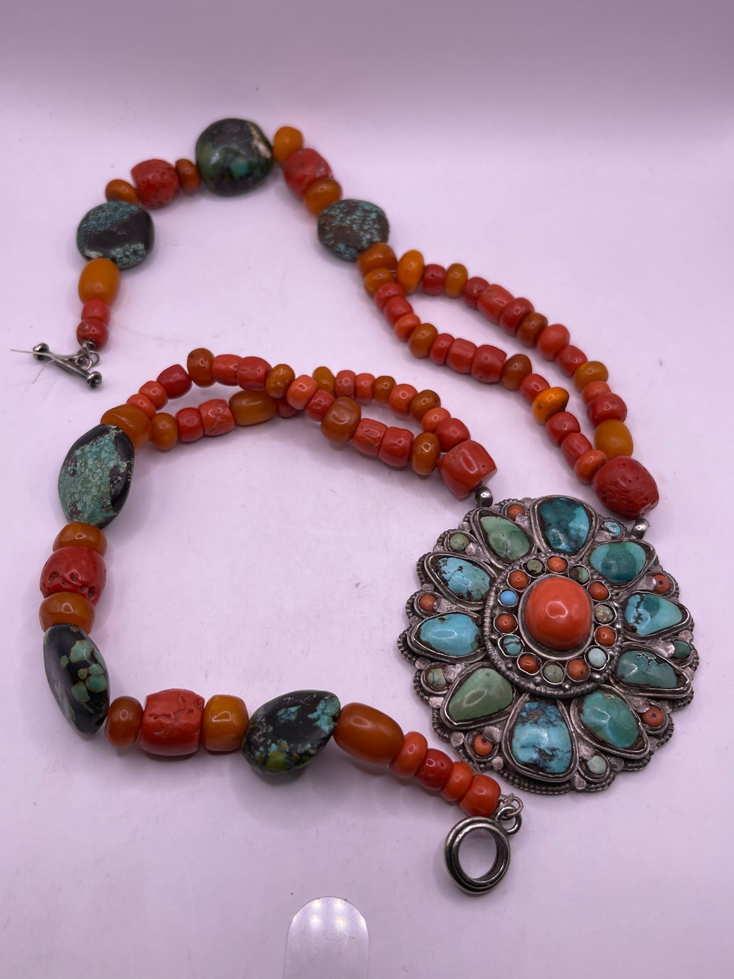 Coral, amber and turquoise necklace with a turquoise and coral silver pendant