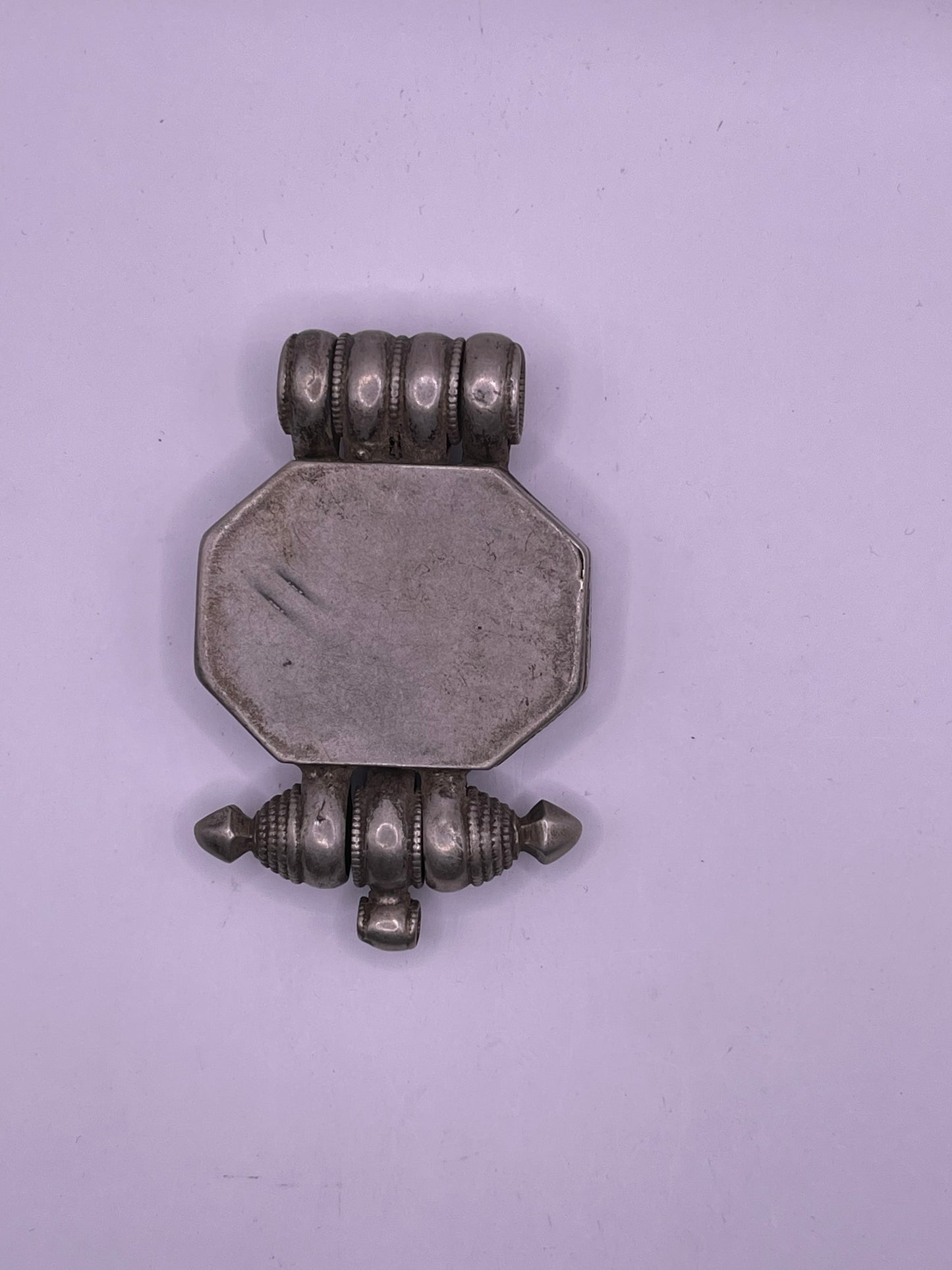 An antique 19th C., few Tibetan silver ghau with silver filigree and turquoise.