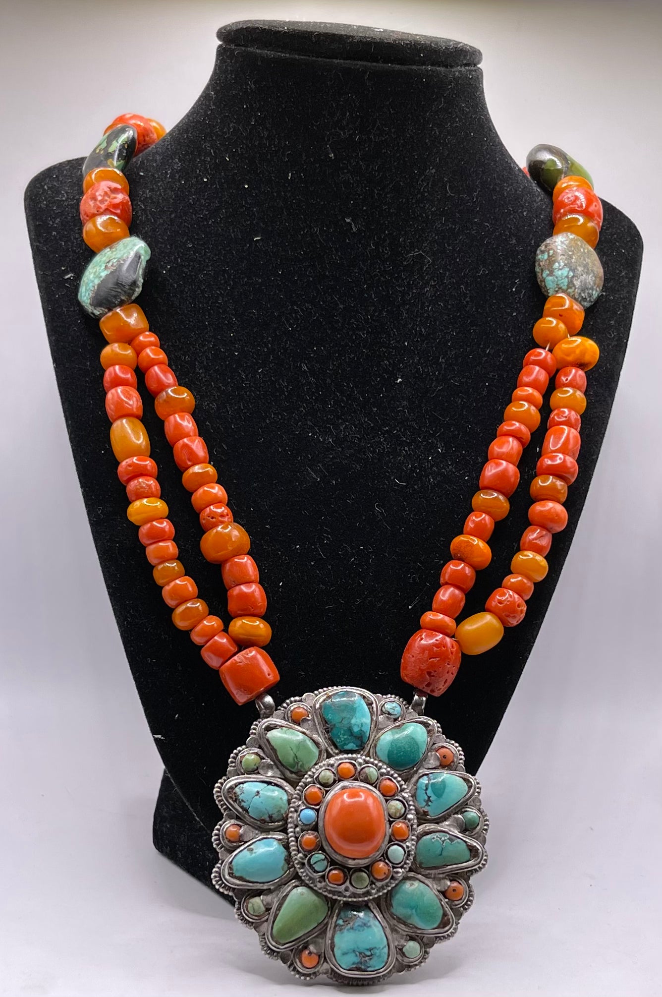 Coral, amber and turquoise necklace with a turquoise and coral silver pendant