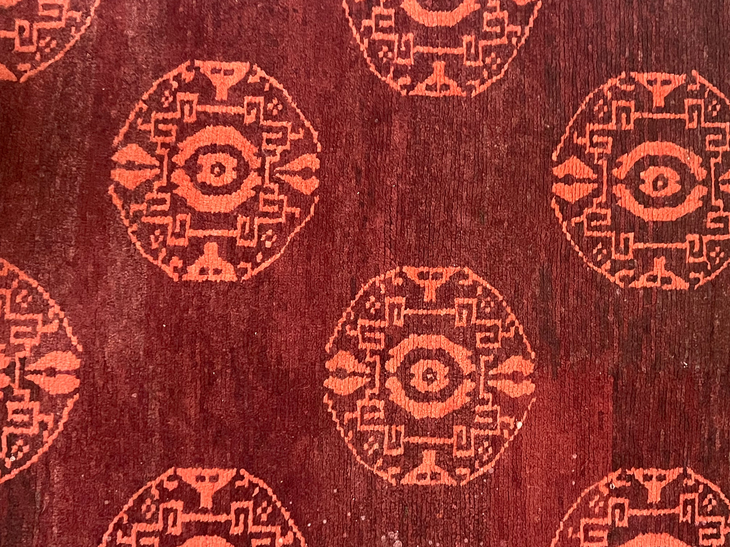 An antique Tibetan rug with coin motifs