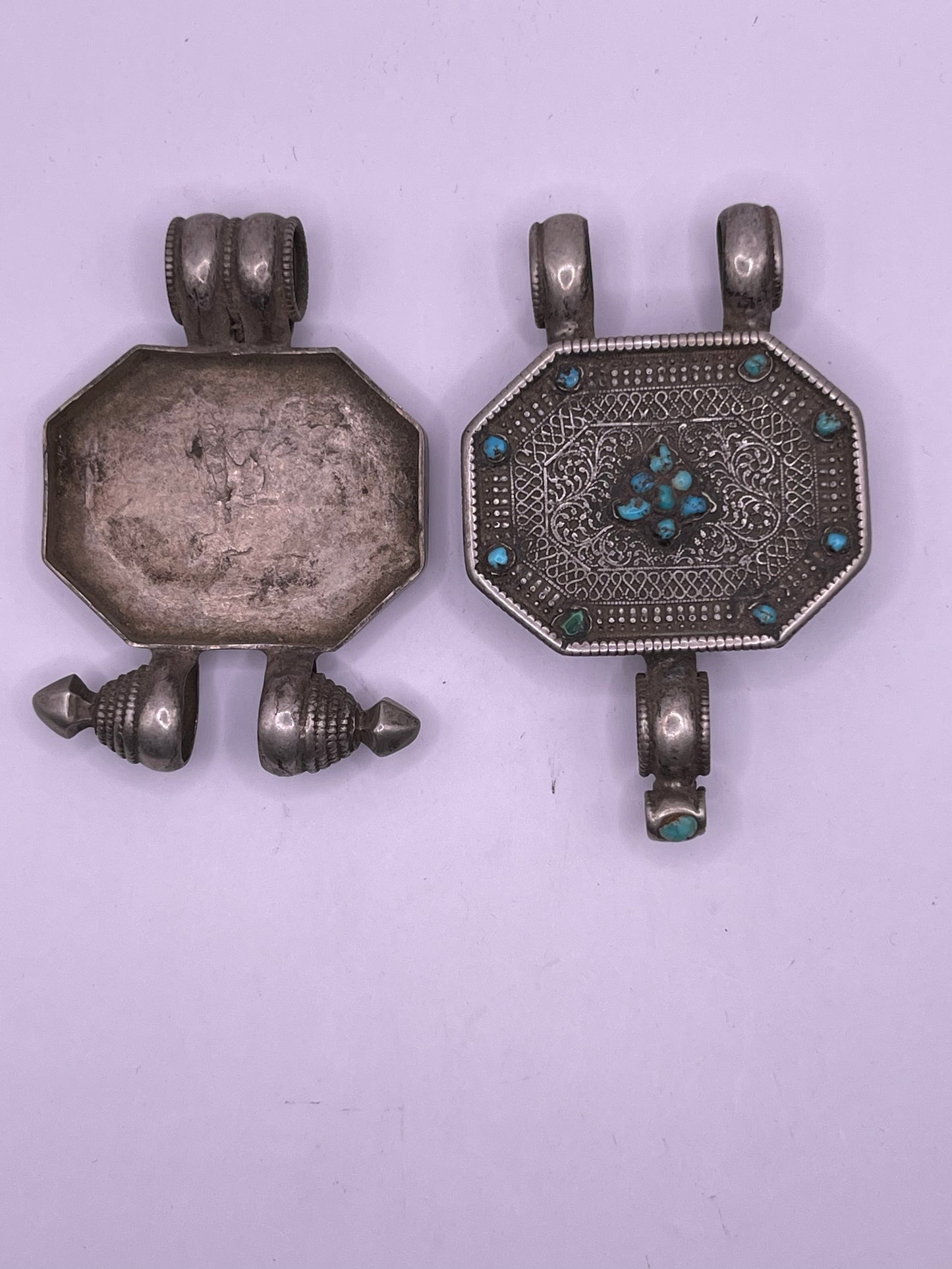 An antique 19th C., few Tibetan silver ghau with silver filigree and turquoise.