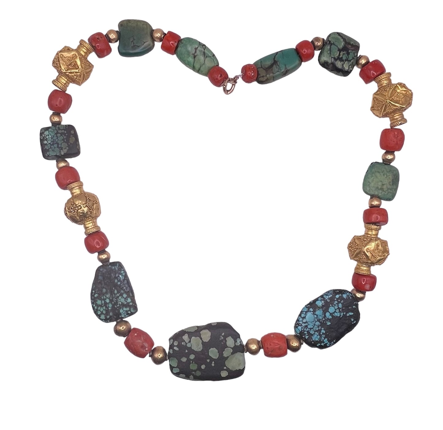 A necklace with antique Tibetan turquoise beads, coral beads and gold beads