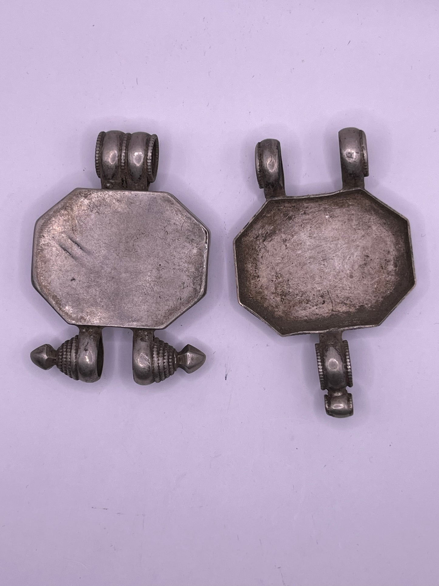 An antique 19th C., few Tibetan silver ghau with silver filigree and turquoise.