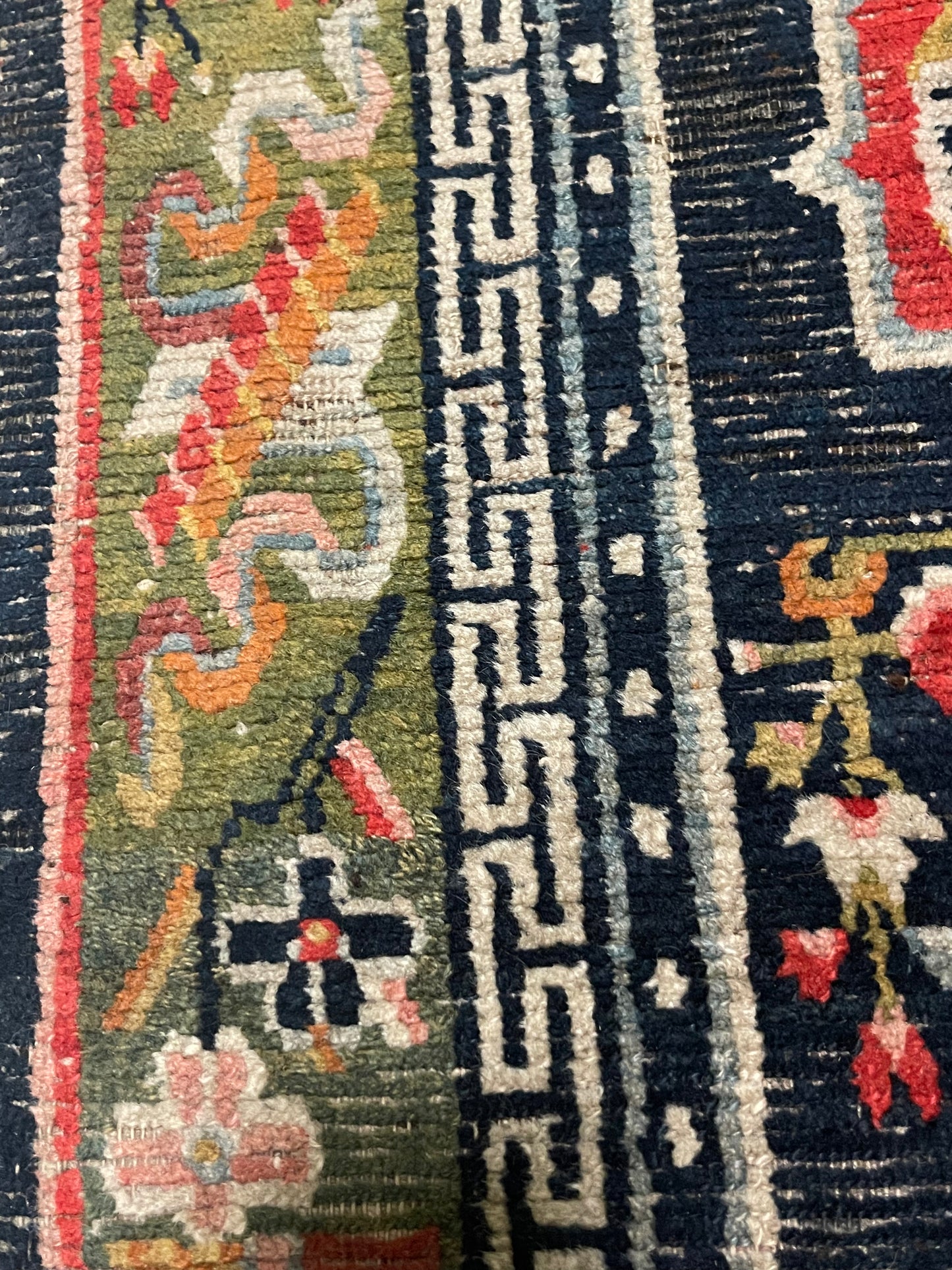 An antique Tibetan residential rug with medallions