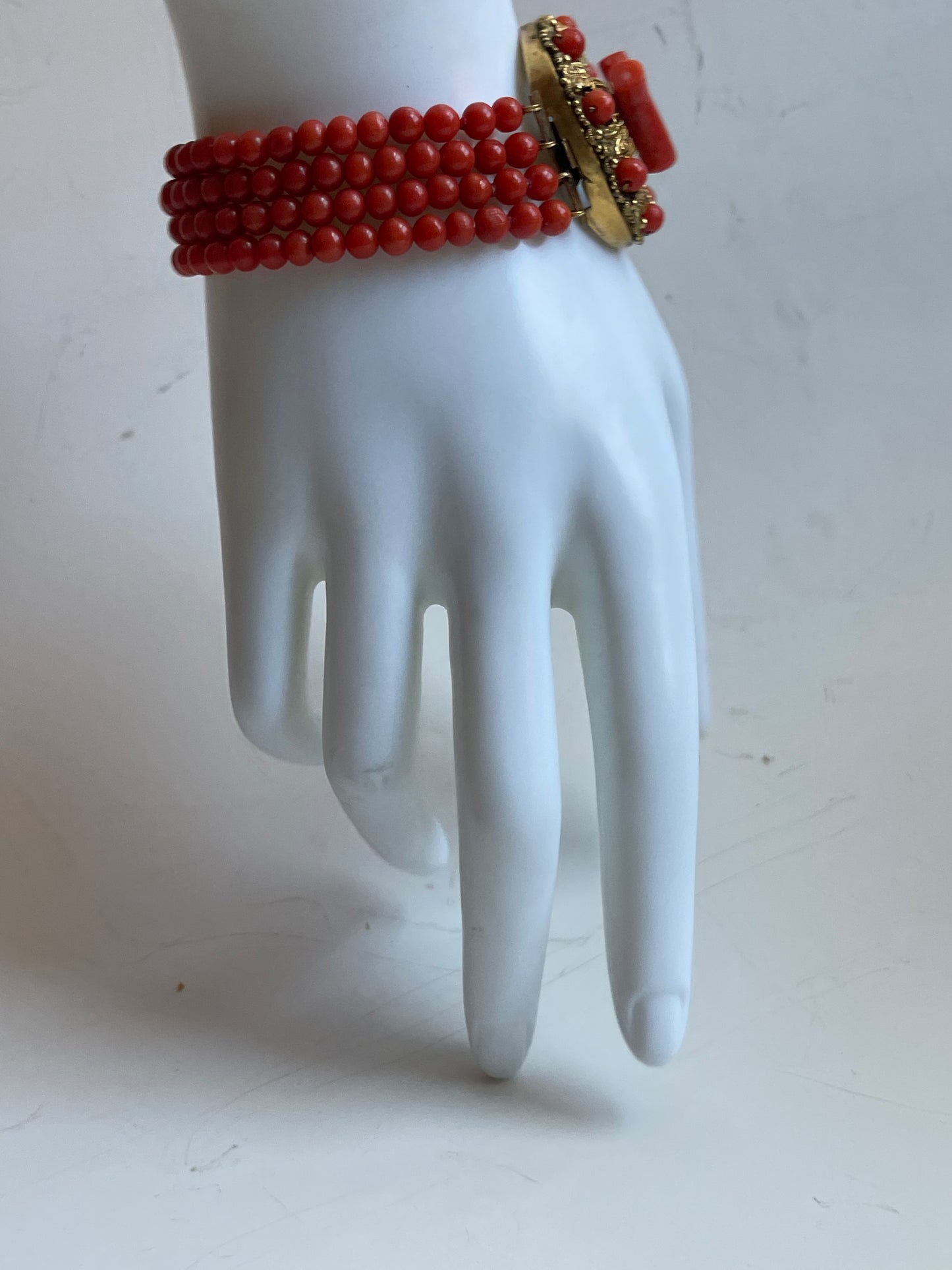 An antique coral bracelet with 4 strings of coral