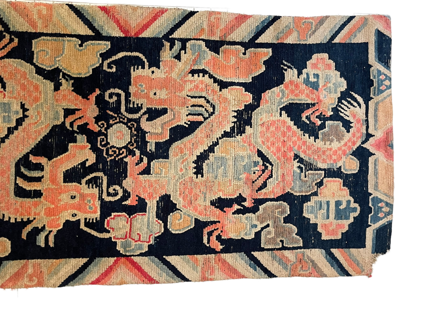 A 19th C., antique Tibetan dragon rug