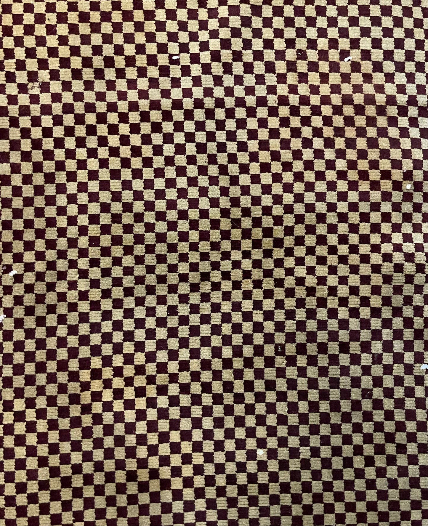 An antique Tibetan checkerboard handmade wool rug