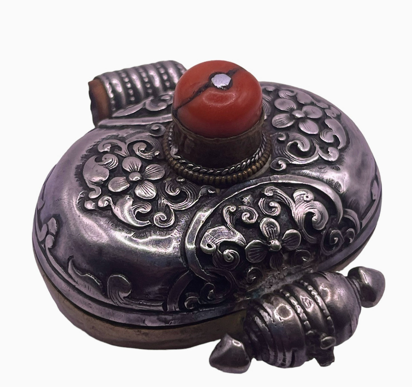 An antique silver and coral ghau amulet