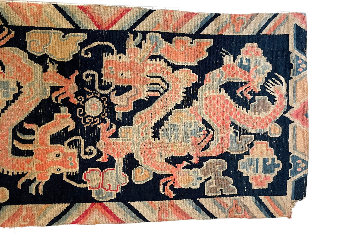 A 19th C., antique Tibetan dragon rug