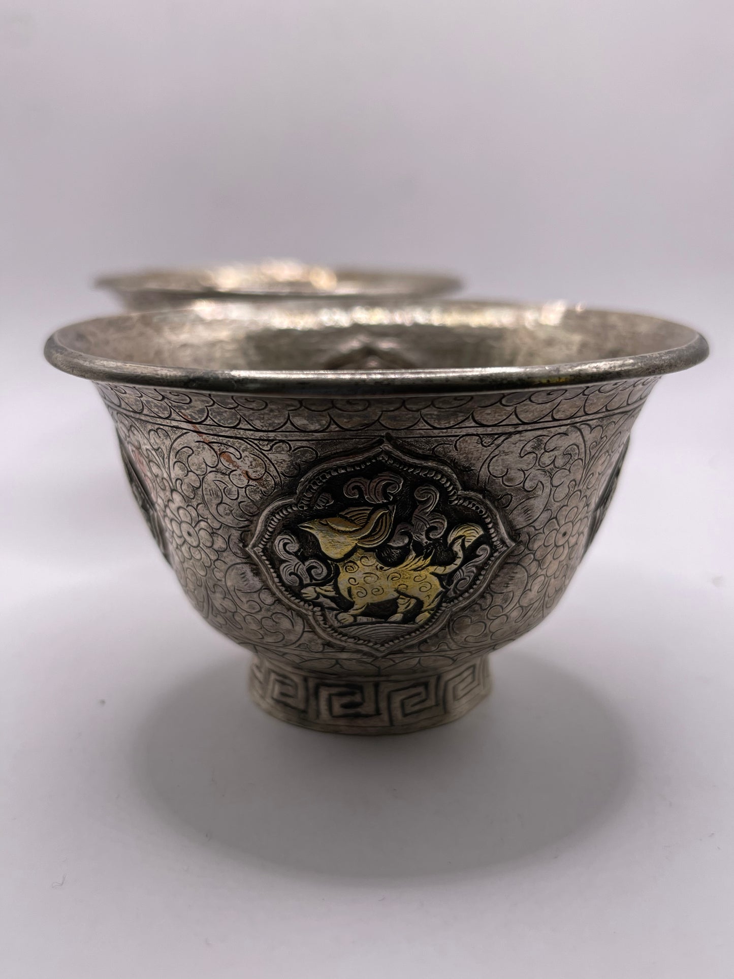 A pair of Tibetan silver cups