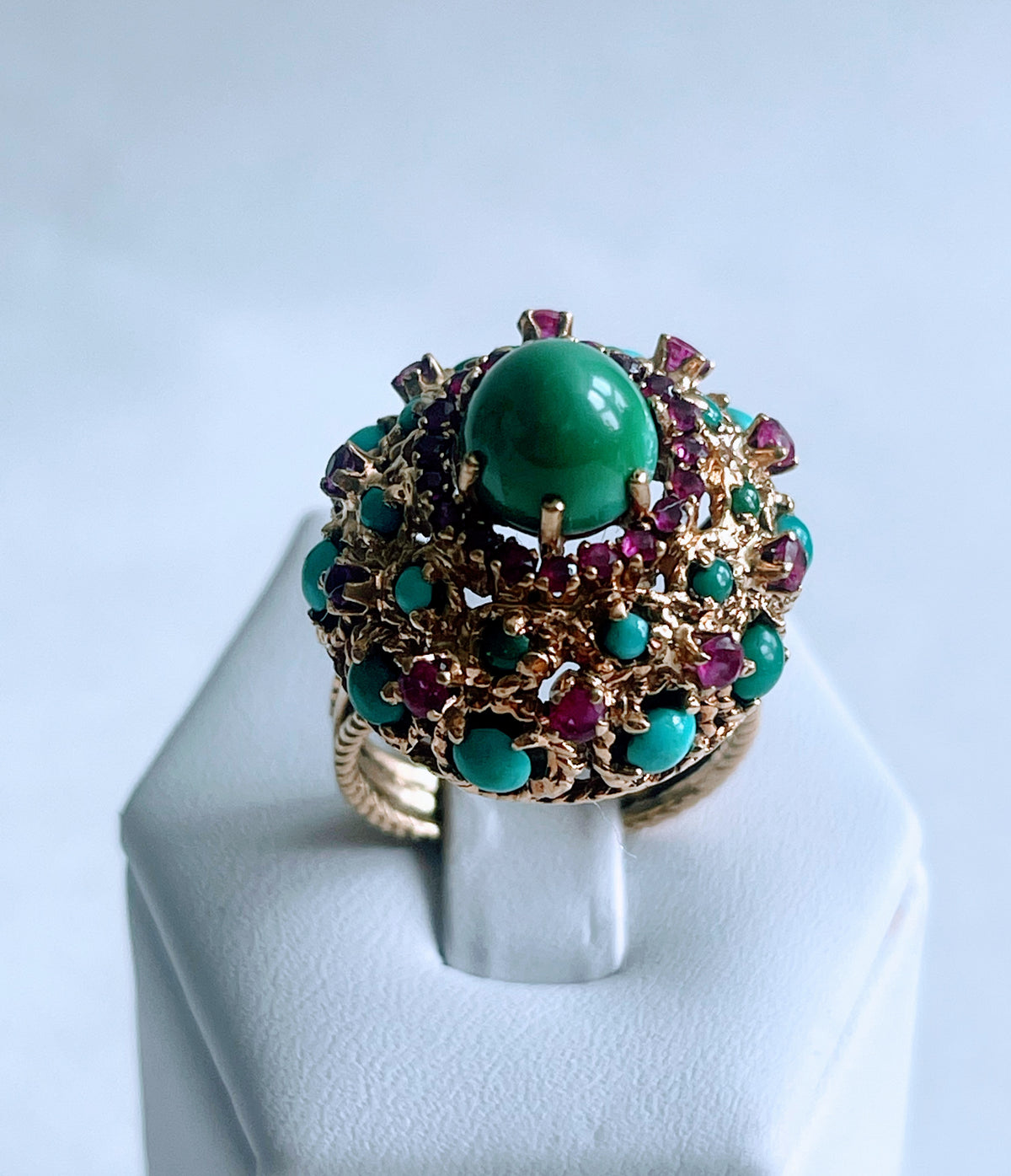 A vintage turquoise dome ring with rubies in a 14kt setting
