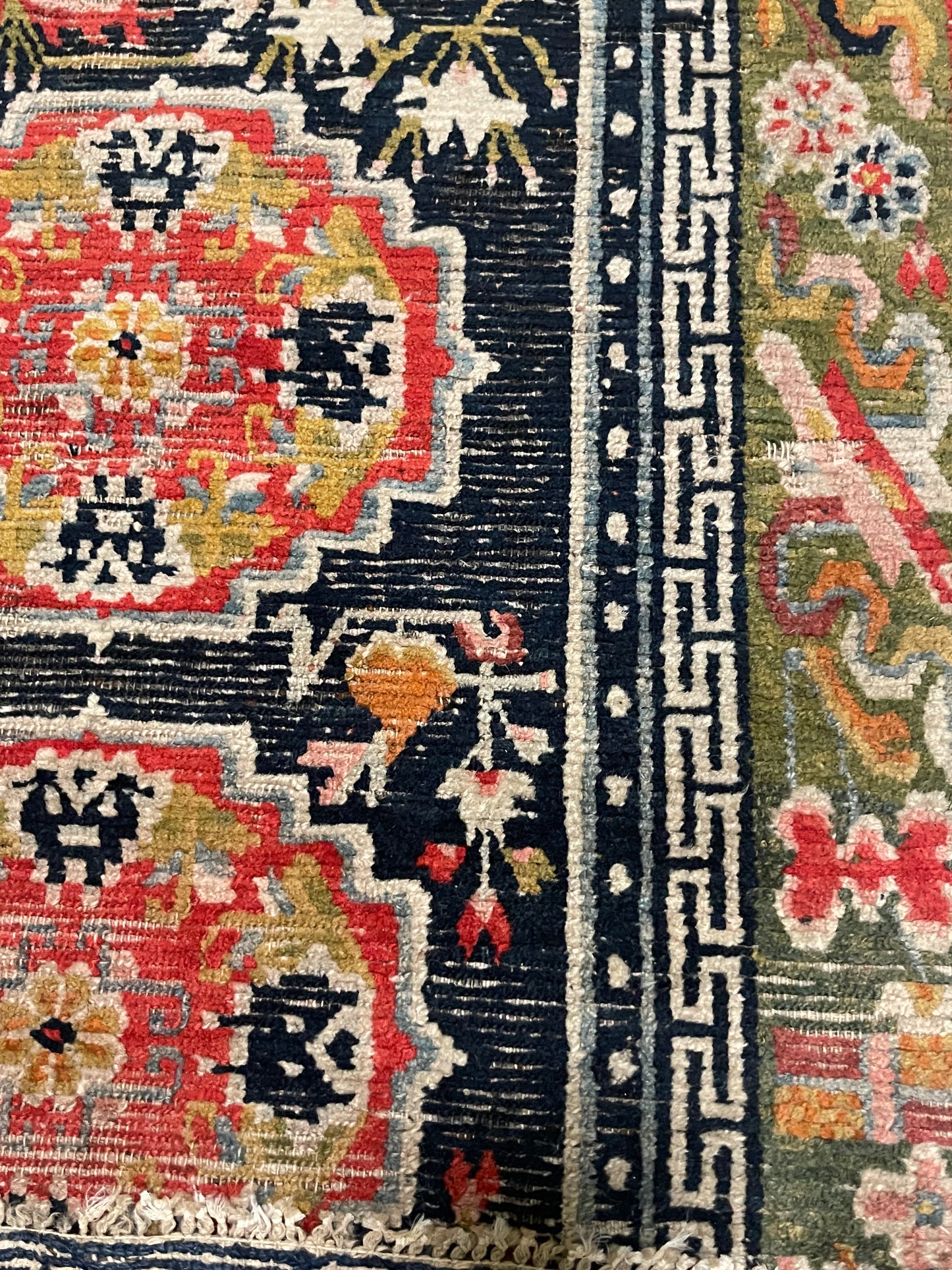 An antique Tibetan residential rug with medallions