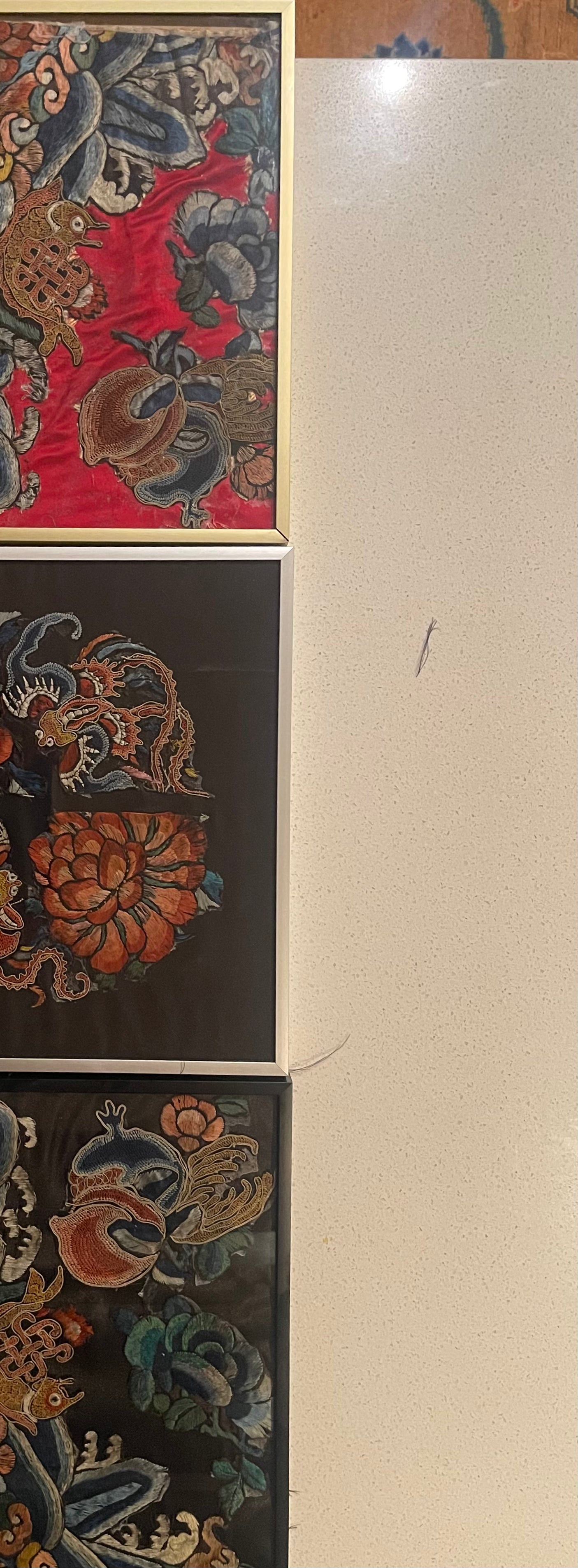 An antique framed Chinese embroidered textile fragment