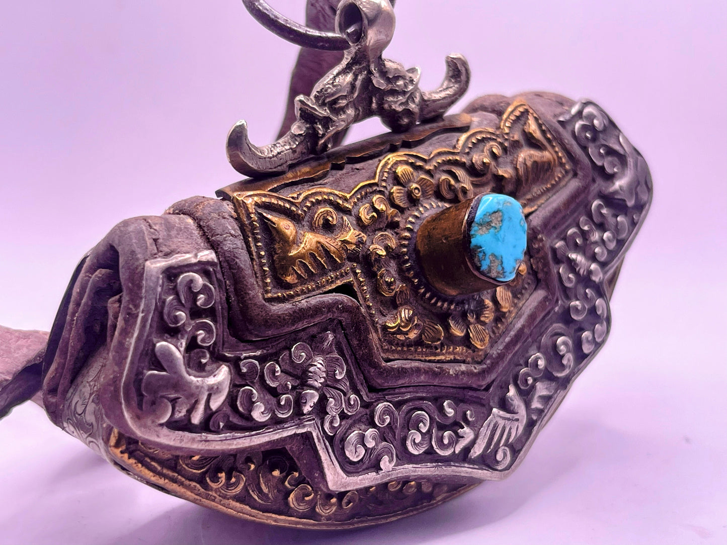 An antique Tibetan mechak purse with turquoise